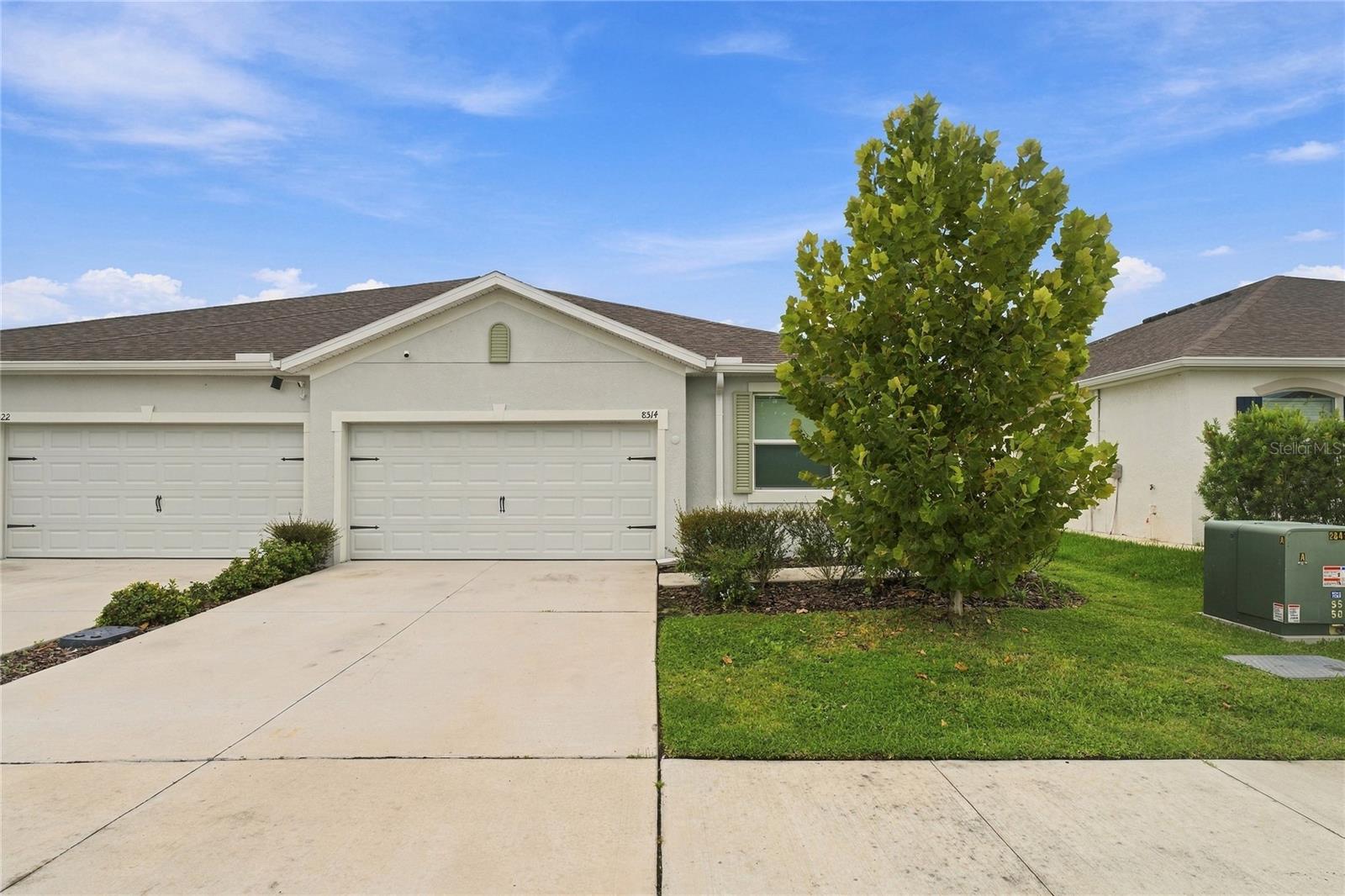 Welcome to this beautiful villa in the quiet Towns at Woodsdale community in Wesley Chapel! This move-in-ready 3-bedroom, 2-bath home features an open floor plan, tile flooring throughout the main living areas, and a spacious kitchen with a large island, stainless steel appliances, and plenty of cabinet space. The split-bedroom layout gives everyone their own space, while the bright living area makes the home feel warm and inviting. Step outside to your screened and covered lanai and enjoy peaceful pond views from your private, fully fenced in backyard. The community offers a pool, cabana, clubhouse, playground, and dog park, with golf carts welcome. Plus, you'll enjoy an incredibly low HOA fee and easy access to I-75, shopping, restaurants, top-rated schools, and the growing Wesley Chapel area.