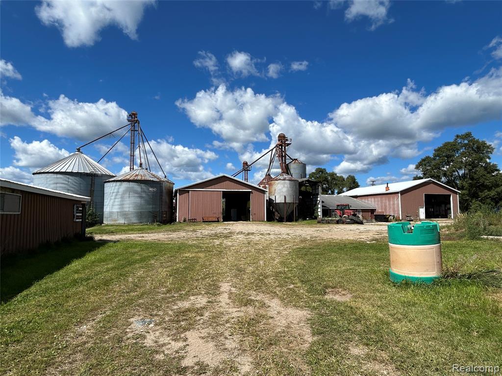Hurry! Don't miss the opportunity to own this 80-acre farm in Allenton, MI! Natural Gas! Paved Road! Sale includes parcel "A" which is made up of two houses (some TLC is needed). Brick ranch is 1650 sq. ft., 1970 blt. featuring 3 bdrms, 2 baths, and a full bsmt. 16415 Almont Rd., which is a 1000 sq. ft., 1940 blt. (green) house featuring 2 bdrms, 1 bath, and a full unfinished bsmt). There's also a nearly completed retail/office building on front of machine shop located near the road which is at the "spray foam has been completed" stage of finishing measures 24' X 38' and has a concrete floor, a huge machine shop/barn (42' X 64' and features 16' wall height and has concrete floors with an large additional storage bldg. (40' X 50') attached to rear of machine shop/barn), a scale barn (40' X 62' w/14' wall height and concrete floors), two additional barns, a grain system (1990), and pasture along with alfalfa that was planted in 2024! Square footage listed (2650) includes the two houses ONLY).