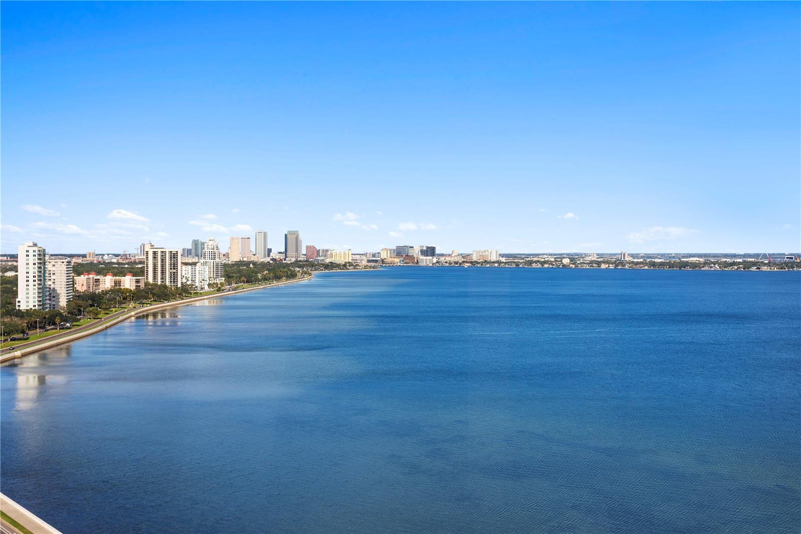 This 3-bedroom, 2-bath BALCONY unit offers breathtaking views of Hillsborough Bay and Tampa Bay from every room! Step into the marble-floored lobby, leading to a spacious living room with floor-to-ceiling windows. The kitchen features solid wood cabinetry, corian countertops, tile backsplash, additional cabinetry and counters added and a private trash chute. The second bedroom/den boasts a walk-in closet, while the third bedroom is adjacent to a full bath with a tub/shower combination and both have gorgeous views! The Primary Bedroom ensuite includes serene views of Hillsborough Bay, dual sinks, a walk-in shower, private water closet, and a large walk-in closet. Hurricane shutters throughout the unit provide peace of mind, the entire elevator lobby is being renovated, and the laundry room is conveniently located off the kitchen. Monte Carlo Towers offers unparalleled amenities, including 24-hour concierge service, 5 elevator towers, 2 guest suites, and a spectacular 24,000 sq. ft. lobby. Enjoy resort-style amenities such as a heated saltwater pool, sauna, gym, tennis/pickleball courts, social room with a commercial kitchen, and a library. Located in an excellent school district, this residence is just minutes from downtown, Amalie Arena, Hyde Park Village, Channelside, Riverwalk, and Tampa International and St. Pete/Clearwater airports. With easy access to major highways like I-275, I-4, and the Selmon Expressway, you’ll enjoy the best of Tampa Bay living, from award-winning beaches to premier dining, shopping, and cultural attractions. Schedule your private showing today and experience luxury living at its finest!