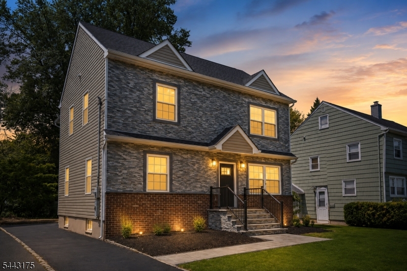 Introducing a beautifully crafted NEW CONSTRUCTION residence in the heart of Springfield! This thoughtfully designed home offers timeless finishes and an effortless, modern aesthetic. Offering 6 bedrooms, 2 full baths, 1 half bath, a finished lower level, and a 2-car garage, this home blends refined design with everyday functionality.Light, wide-plank flooring flows throughout the light-filled interior, complemented by an open-concept layout ideal for both daily living and entertaining. The eat-in kitchen serves as the centerpiece of the home, featuring striking granite countertops, custom cabinetry, and a breakfast bar. Two first-floor bedrooms provide exceptional flexibility, with one that can be easily transformed into a private home office or study. Upstairs, the serene primary suite is highlighted by a dramatic wall of windows, dual walk-in closets, and a beautifully appointed bath with a double vanity and oversized walk-in shower. A second-floor laundry room with a utility sink adds everyday convenience. The finished lower level offers endless possibilities for a media room, recreation space, fitness studio, or playroom. Ideally situated near parks, shopping, dining, major highways, and NYC transportation, this exceptional residence offers the perfect balance of sophisticated design, comfort, and convenience! *Virtually Staged/Enhanced , house on existing foundation*