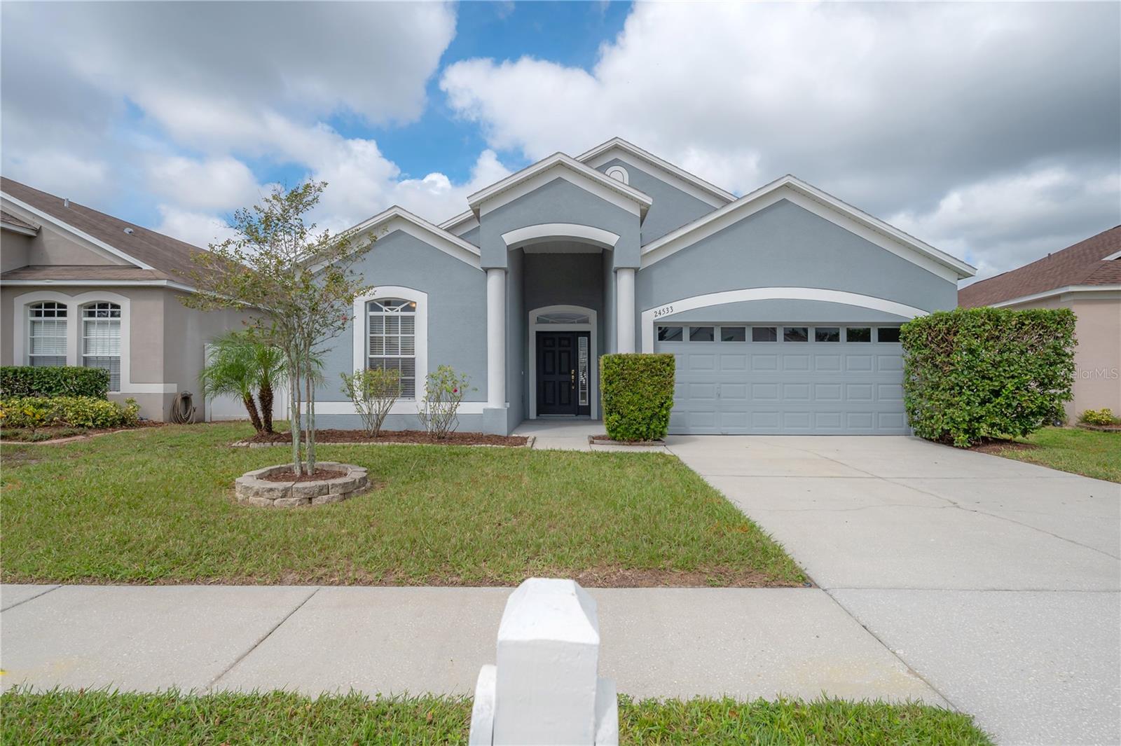 Outstanding renovated 3-bedroom, 2-bathroom house with a 2-car garage, screened saltwater pool, and spa, all set within a private vinyl-fenced backyard in a very low-fee HOA community. Perfectly located less than half a mile from highly rated Denham Oaks Elementary and close to grocery stores, shopping centers, the Premium Outlets, and restaurants, this home offers both comfort and convenience. The inviting outdoor living area features a spacious covered lanai, screened saltwater pool and spa and privacy from the vinyl fence. A child safety fence is conveniently installed for ease of use and peace of mind. The pool views from the primary suite, living room, and kitchen fill the home with natural light, and this, combined with the open floor plan and generous common areas all contribute to creating a bright and spacious living space. Thoughtfully remodeled throughout, the kitchen with breakfast bar, nook and coffee station boasts stainless steel appliances (including a gas stove and French door refrigerator with water dispenser), granite countertops, updated cabinetry with crown molding, newer hardware, recessed lighting, and modern plumbing fixtures. Both bathrooms feature granite counters, upgraded cabinetry, and refreshed lighting. The primary suite includes a walk-in closet, dual sinks, jetted tub, and separate shower. Additional updates include new tile flooring in common areas, fresh exterior paint (2019), gas-connected A/C (2019) & water heater (2013) for energy savings, and a roof (2019) with upgraded dimensional shingles offering durability and storm resistance. All this, with an HOA fee of only $245 per year. With its stylish updates, inviting outdoor retreat, and ideal location near schools, shopping, dining, and easy access to I-75 and I-275, this home is a sanctuary designed for both relaxation and entertaining.