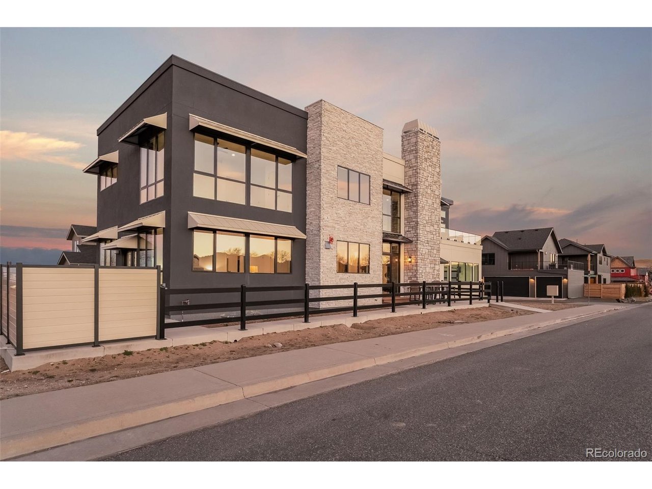 NEW CONSTRUCTION striking contemporary residence set across the street from Founders Park in Old Superior, offering panoramic park and Flat Iron views through expansive walls of glass. Priced drastically under two appraisals!  Thoughtfully designed for a luxury lifestyle, this newly built home features a private elevator, bespoke finishes, and an oversized, extra-deep garage bay.  Perfectly located just off Highway 36, you're less than 10 minutes from Boulder, with shops, dining, and everyday conveniences just a short walk away-while still enjoying seamless access to Denver.  Inside, the dramatic great room is defined by soaring two-story ceilings, a statement marble fireplace, and floor-to-ceiling windows that flood the space with natural light. The chef's kitchen is equally refined, appointed with quartz countertops, Wolf and Sub-Zero appliances, and an open-concept layout ideal for entertaining.  The main-level primary suite is a serene retreat, featuring direct patio access, full-height glass, and breathtaking views. Spa-inspired marble bath, complete with a walk-in shower and dual vanities.  Take the sculptural floating staircase up to two additional bedrooms, a full bath, and a sophisticated family room that opens to a generous view deck-perfect for taking in the surrounding landscape.  Easily access every level with the private elevator, the finished lower level offers a spacious recreation/media room and a private guest suite with a three-quarter bath. Completing the home is an oversized two-car garage with an extra-tall door, ideal for recreational vehicles or collector cars.  A rare opportunity to own a modern architectural home that delivers elevated design, exceptional views Flat Iron Views, and unmatched convenience between Boulder and Denver.