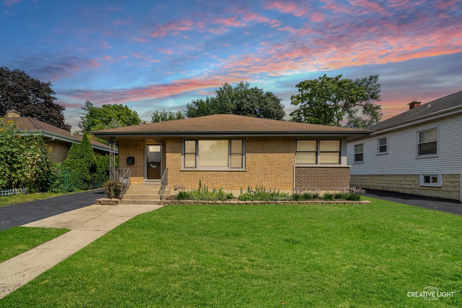 This all brick ranch home offers so many great features with over 2400 square feet of living space!  The updated eat-in kitchen has white shaker cabinets, quartz counters, glass tile backsplash and all stainless steel appliances including the built-in oven, cook top, refrigerator, dishwasher and microwave.  Hardwood floors throughout the dining room, living room and all 3 bedrooms. Bathroom was updated in 2020.  Full finished basement with family room, recreation room, laundry room with cabinets and utility sink, office, workshop and still plenty of room for storage space.  Outside in the fenced in yard is the 2 1/2 car garage, patio and storage shed.  The location is a commuter's dream as it is a block away from the Metra station and easy access to shopping, dining and I294, I88, I290, I355 and minutes away from Route 64, 83 and 38.  Welcome home!
