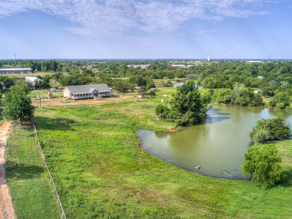 Discover this 4-bedroom, 2-bathroom home on 15 acres of scenic land. it holds limitless potential to become your dream property. Enjoy the a great barn, a stocked fishing pond, and a fully fenced perimeter for added privacy. Multiple sheds and ample space offer endless possibilities. Bring your vision to life and make this property truly your own! This is an opportunity with endless potential to be your dream come true!