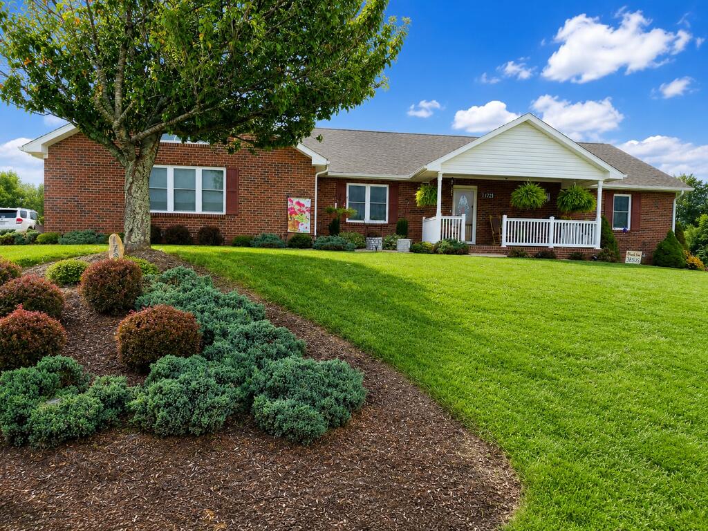 Welcome to this well-maintained 3-bedroom, 2-bath brick home located on a quiet street in Hillsville. Built in 2016 and situated on a nicely landscaped lot, this move-in-ready home offers excellent curb appeal and has been exceptionally well cared for. Inside, you'll find a spacious open floor plan with hardwood flooring throughout the main living areas and tile flooring in the bathrooms. The attractive kitchen features custom cabinetry, tile backsplash, a center island, stainless steel appliances, and a pantry, all opening to a generous living area. The primary bedroom offers a private bath and walk-in closet, while two additional generously sized bedrooms and another full bath provide plenty of space for family or guests. Additional features include a convenient laundry area, oversized 2-car garage, covered front porch, and open back deck overlooking the manicured yard. Outside, you'll also find a 12x20 outbuilding along with an additional storage building. Clean as a pin and truly move-in ready, this beautiful home is conveniently located near schools, shopping, medical facilities, and everything Hillsville has to offer.