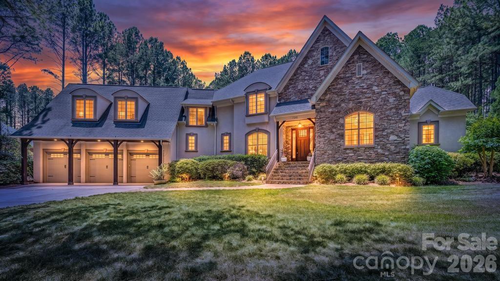 Perfectly positioned on a private homesite within an exclusive gated section of Pebble Bay, this exceptional custom residence delivers an unmatched blend of elegance, craftsmanship, and resort-style outdoor living. Built by renowned Kimberly James Construction, this meticulously maintained hard stucco-and-stone estate showcases the quality finishes and thoughtful upgrades today’s discerning buyers seek.Designed for both everyday living and effortless entertaining, the thoughtfully crafted open floor plan features a dramatic two-story great room, 10-foot ceilings on the main level, 9-foot ceilings upstairs, 8-foot doors, rich heavy moldings, tray ceilings, vaulted ceilings with exposed wood beams, and stunning American cherry hardwood floors throughout the main living spaces.At the heart of the home, the chef’s kitchen was designed to impress, featuring an oversized island with breakfast bar, Thermador 5-burner gas cooktop with hood vent, stainless steel appliances, timeless cabinetry, quartz countertops, prep sink, and two spacious pantries offering exceptional storage and functionality.The luxurious main-level primary suite serves as a private retreat, complete with a spa-inspired bath featuring a soaking tub, oversized tile shower with rain and body spray heads, exotic granite countertops, and generous dual walk-in closets. A spacious private office with custom built-ins provides the perfect work-from-home setting.Upstairs, each guest bedroom enjoys its own beautifully appointed en-suite bath, offering privacy and comfort for family and guests alike. The versatile bonus/media/billiard room with wet bar, exotic granite countertop, and full bath offers endless flexibility and could easily serve as a fourth bedroom.Step outdoors and discover your own private resort. The fenced backyard oasis is anchored by a stunning vaulted tongue-and-groove pavilion and fully equipped outdoor kitchen featuring a built-in gas grill, side burner, stainless refrigeration, and generous prep space. Thoughtfully designed hardscaping surrounds the spectacular Gunite in-ground pool, creating the perfect setting for entertaining or quiet relaxation.Combine all of this with low county taxes, the privacy and security of a gated community, and the sought-after lifestyle Pebble Bay is known for, and the value is truly exceptional.  A gated boat storage, community boat ramp & day slips make this the perfect Lake Norman destination!Your private Lake Norman retreat awaits. Don't miss this exceptional beauty!
