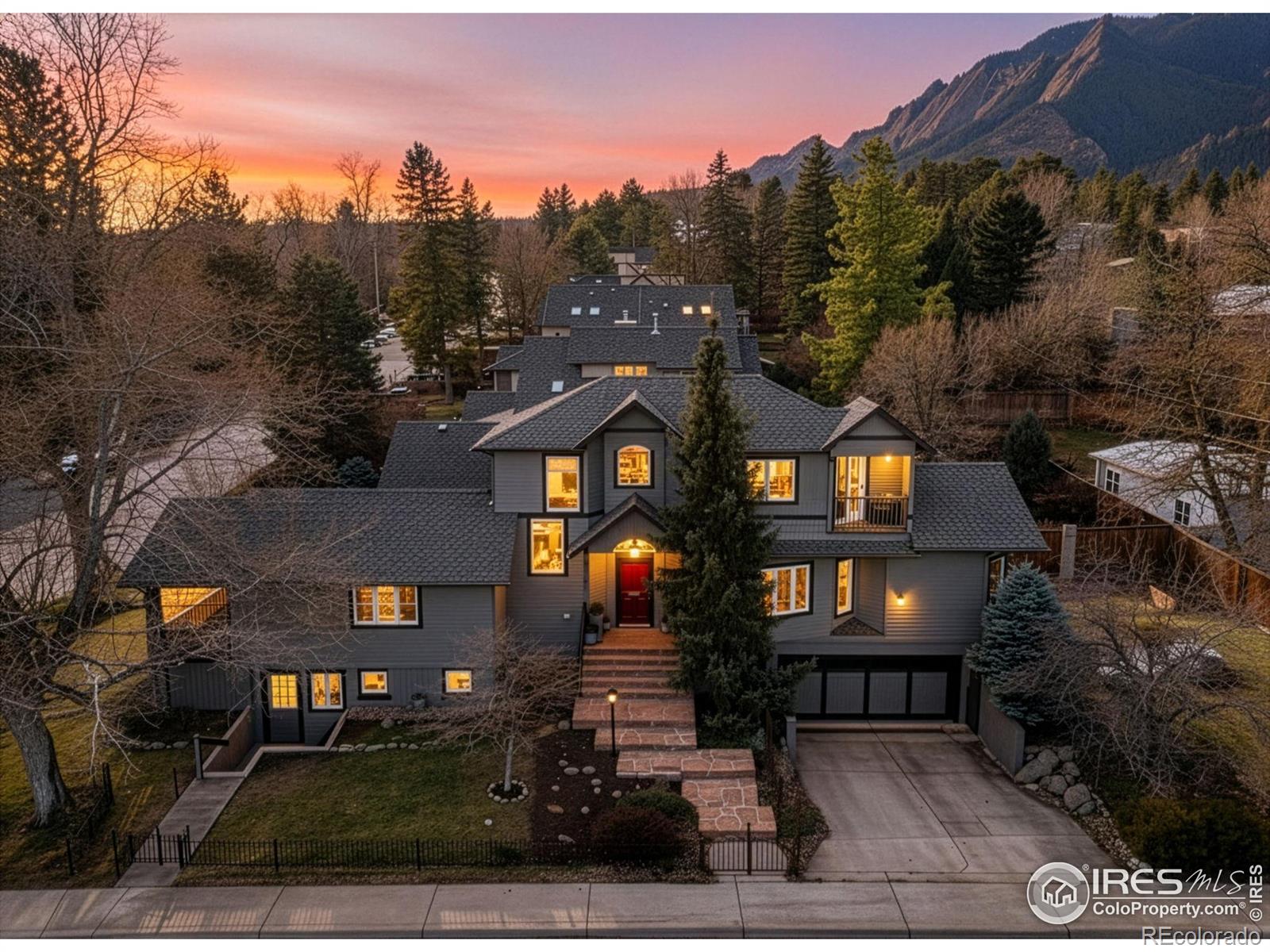 Showings to start Thursday, 1/22/26. Welcome to this beautifully renovated West Rose Hill residence, perfectly positioned to capture Foothill and Flatiron views. This exclusive home blends historic Boulder charm with a bright, open-concept floor plan and abundant natural light throughout. The updated main level features a primary suite with a private covered porch, site-finished hardwood floors, radiant heated flooring, quartz counters, maple soft-close cabinetry, Wolf gas stove, two Fisher Paykel dishwashers, and the rare convenience of a heated driveway. The inviting great room offers a gas fireplace and vaulted ceilings, creating a warm and spacious gathering space. A highly functional layout provides a main level primary, two bedrooms upstairs, and a private lower-level suite complete with two separate entrances and a rec room or additional family room - perfect for a live-in nanny, guest, or family member. Bathrooms on all three levels maximize comfort and convenience.Set on a fully enclosed, private corner lot, the property includes irrigation, garden areas, and charming custom wrought iron fencing. Recent improvements include a beautifully renovated kitchen, powder room, guest bathrooms, new A/C, a new back deck, upgraded lighting throughout and more. Located in a prime Boulder location near Chautauqua Park trails, Flatirons Elementary, Alpine Modern Cafe, Pearl Street, and more, this home offers the best of Boulder living.