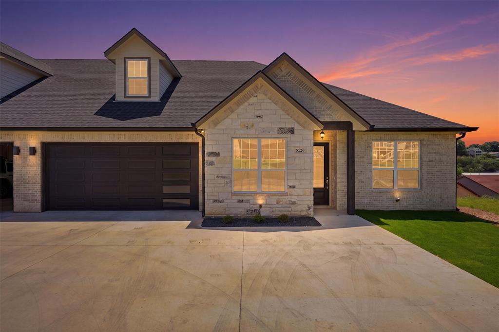 Welcome to the coveted DeCordova Bend Estates! This stunning new construction duplex is your ticket to lakeview living. Offering over 3000 square feet of thoughtfully designed living space in a sought after golf course community this 4 bedroom, 3.5 bathroom home combines functional layout with elevated finishes and multiple areas for entertaining.The main level features an open concept kitchen designed to stand out with gleaming quartz countertops, abundant cabinetry, and a walk in pantry. The kitchen flows seamlessly into the living and dining areas, creating an ideal space for everyday living and hosting. A walkout balcony extends the living space outdoors and provides serene lake views, perfect for morning coffee or evening relaxation.The primary suite offers a comfortable retreat with a well appointed bathroom and generous closet space. Additional bedrooms are well sized and thoughtfully positioned to provide flexibility for guests, office space, or additional living needs.The lower level adds versatility with a large bonus room that can be used as a media room, game room, or secondary living area. A two car garage is located on the main level, along with an additional lower level garage designed for golf cart storage and added convenience.Residents enjoy access to a variety of community amenities including two golf courses, marina, community pool, pickleball courts, sand volleyball, and more.