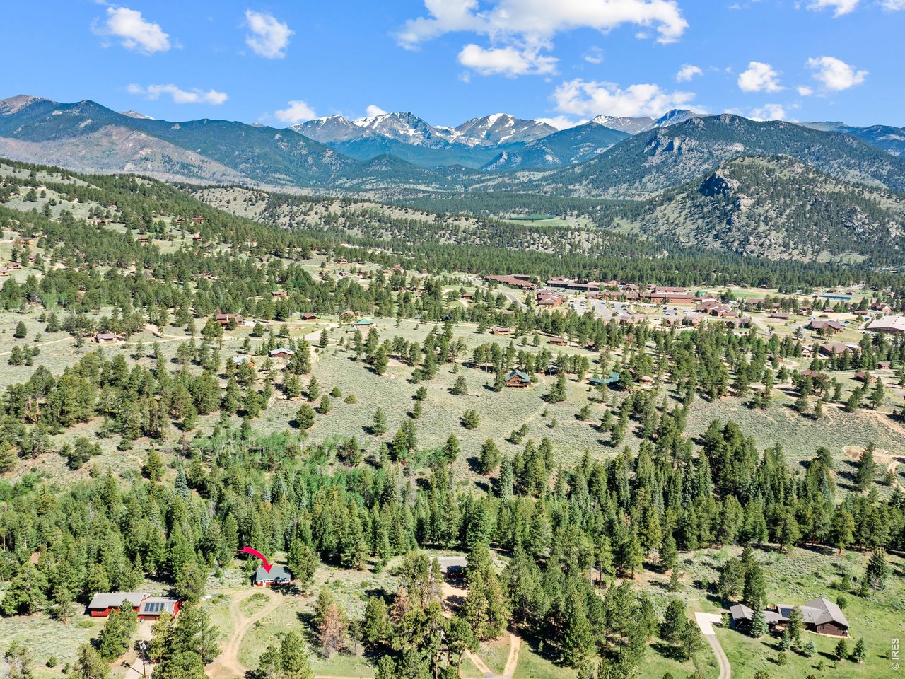 Experience the charm of mountain living in this classic 1940s Estes Park seasonal cabin, perfectly situated on over two private acres with mature trees and bordering a seasonal stream plus breathtaking mountain views. Featuring 2 bedrooms and 1 bathroom, spacious living/dining room and a retro kitchen, this lovingly maintained, cozy retreat blends rustic character with peaceful seclusion. Enjoy abundant wildlife and the serenity of Colorado's natural beauty from the private deck, all while being just minutes from town. Ideally located at an entrance to Rocky Mountain National Park, this property offers easy access to some of the area's most popular hiking trails-many accessible without the park's timed-entry reservation requirements. Whether you're seeking a weekend getaway or your own mountain escape, this turn key property captures the timeless allure of Estes Park.