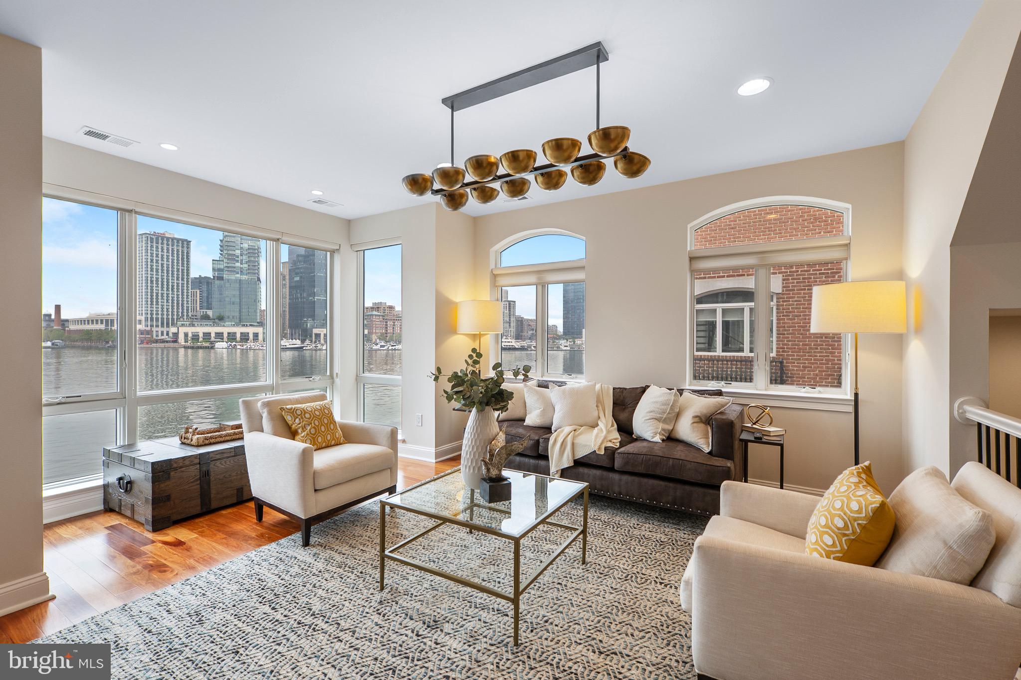 A truly exceptional opportunity to own one of Baltimore’s most unique and coveted residences at the Pier Homes at Harborview. Ponte Villas S offers exceptional proximity to Washington DC and Baltimore’s central business district. Minutes from I95, the nations capital and key DC locations are within 35-40 miles by car and easily accessible via the MARC Camden line in 30-45 minutes. The new corporate campuses of T. Rowe Price and Under Armour are minutes away via water taxi, a short walk or drive. Residents enjoy the best of both worlds — serene waterfront living with effortless access to the nation’s capital. This striking four-level townhome at 650 Ponte Villas South offers an extraordinary living experience with panoramic, stunning views of the Inner Harbor from nearly every room. The seamless connection between elegant interior spaces and the tranquil waterfront setting creates an atmosphere of sophistication, privacy, and serenity rarely found in city living. Enter through a private, secure entrance into the main level, where you will find a private guest suite complete with an en-suite bathroom and convenient elevator access to every floor — ensuring comfort and accessibility throughout the home — and a two-car garage. The next level features an open-concept living space boasting high ceilings, rich hardwood floors, and expansive windows framing the harbor’s waters. The gourmet kitchen features premium stainless-steel appliances, granite countertops, custom cabinetry, and a large breakfast bar — perfect for entertaining. The adjoining dining and living areas — separated only by an elegant double-sided gas fireplace — flow effortlessly toward a private waterfront terrace, ideal for an evening of relaxation while watching boats glide across the harbor. The entire third level hosts a beautifully appointed primary suite offering a sitting area, an additional double-sided gas fireplace, a private terrace, and floor-to-ceiling windows that capture breathtaking sunrise views over the marina. The spa-inspired en-suite bath includes dual vanities, a soaking tub, and a large, separate glass-enclosed shower. A spacious walk-in closet complements the suite’s refined design. The fourth level features an additional flexible social space and outdoor terrace, perfect for entertaining or relaxing, as well as two spacious bedrooms offering generous storage and a well-appointed family bathroom. Take the stairs or private elevator to the spectacular rooftop terrace with wet bar, boasting nearly 1,000 square feet of outdoor living space with jaw-dropping panoramic views — ideal for sunset gatherings or starlit evenings. Residents of the Pier Homes at Harborview enjoy exclusive access to a private, resort-style Health Club featuring a state-of-the-art fitness center, heated indoor pool, whirlpool spa, and sauna — all designed to promote wellness and relaxation. Beautifully maintained waterfront promenades, landscaped courtyards, and a marina setting enhance the community’s tranquil, upscale atmosphere. With 24-hour security and concierge service, residents experience a perfect balance of luxury, comfort, and peace of mind. Living at the Pier Homes at Harborview offers more than a home — it’s a refined lifestyle defined by health, privacy, and spectacular harborfront living. Baltimore’s Inner Harbor is set for an exciting transformation with the $900 million Harborplace redevelopment, breaking ground in fall 2026. The project will replace the aging pavilions with four new mixed-use buildings featuring retail, dining, residential, and vibrant public spaces, creating a revitalized waterfront that enhances walkability, commerce, and livability. This  will further solidify the Inner Harbor as the city’s premier cultural and social hub.