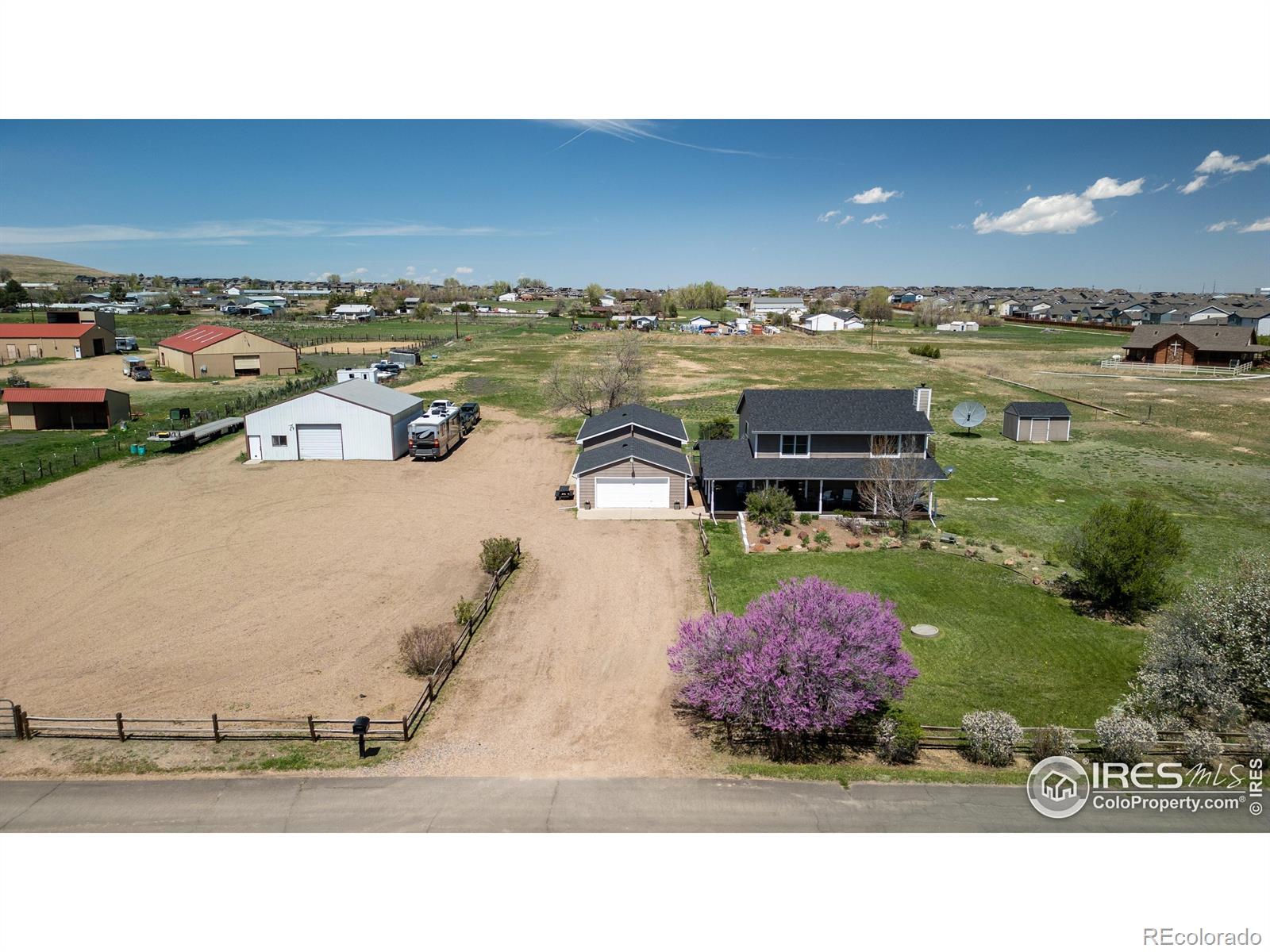 Home AND Business together! Farm Animals, Easy commute! Perfectly positioned 5 minutes off of I-25 at the HWY 7 exit, this 4.75 acre fully fenced lot and home is perfect for the family that needs space but wants access to everything northern Colorado has to offer. With DIA 23 minutes away and less than 20 miles to Boulder or downtown Denver, you can be close to where you need to be, and still be able to have your animals, garden and home business all in one great place (Weld County usage allows for flexibility). The beautiful 2 story house with full basement provides 3168 feet of living space. With 5 bedrooms (one is not conforming) and 3 1/2 baths, you will have plenty of room for everyone. The large master even has it's own balcony to watch the sun rise over the plains. Find solid wood cabinetry, free standing wood stove, large basement pantry/storage, open kitchen/dining, large family room (and another in the basement), wet bar, RO water system, hot tub, large porches, fenced pet run area, no HOA, end of private road with no traffic, 1520 sqft additional workshop/garage (220v metered separately with very tall walls, storage racks and own address), out of city limits and in more lenient Weld County, zoned AG, check out allowed uses under the document tab), eligible for Home Occupation Permit, close to Colorado National Golf Club and just way too much to include here. Tons of shopping and restaurants close by and a park right across the street. Looking long term, this is one of the nicer properties in a micro-geographic area that will be slowly bought up and rebuilt by those wanting this increasingly hard to find way of life. These are perfect sized parcels to build larger homes with country style amenities; it's easy to take a closer look and realize just that. Call me today and see for yourself. Properties with all this are rare.