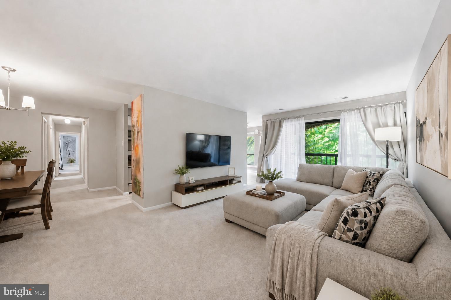 0.6 mi to Wiehle-Reston East Metro • Private covered balcony with tree-facing views • 3BR/2BA single-level condo with 2 assigned parking spacesThis spacious unit combines updated kitchen and baths with neutral finishes with 3-bedroom, 2-full-bath condo offering 1,330 square feet in Chestnut Grove. The single-level layout includes a large living room with sliding-door access to a private covered balcony, a separate dining area, and a galley kitchen with Frigidaire appliances, white cabinetry, generous counter space, gas cooking, refrigerator, microwave, and dishwasher. A windowed table area at the end of the kitchen adds useful everyday dining space in addition to the open dining room. Flooded with natural light throughout. New HVAC. The floor plan provides three bedrooms plus flexible function for a home office, guest room, or additional work-from-home setup. In-unit laundry adds everyday convenience. The primary bedroom gives ample storage in it's walk-in closet with extensive shelving and a separate walk-in pantry for cooking convenience. Condo fee includes your utilities, and the home conveys with 2 assigned parking spaces. Chestnut Grove community amenities include an outdoor pool, tennis court, tot-lot/playground, grills, and picnic area. Located approximately 0.6 miles from Wiehle-Reston East Metro, near Reston Station, the W&OD Trail or walk along the Reston Blue Trail through scenic golf courses to Lake Anne Shopping Center. Easy access to Lake Fairfax-area trails, VA-267/Dulles Toll Road, and VA-7/Leesburg Pike.