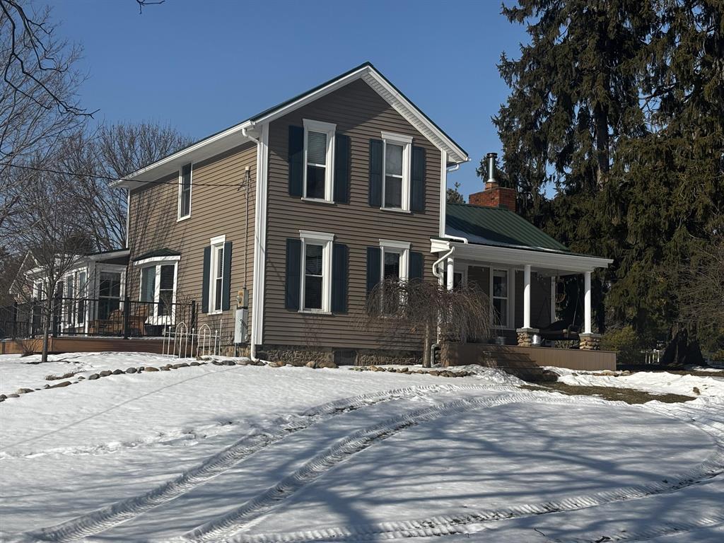 This beautiful, historic renovated farmhouse & gambrel barn are located just outside of the Manchester city limits on 14.84 acres.  4 bedrooms, 3 baths, hardwood floors, Mid-Continent cabinetry, master bathroom with radiant heated floor, end match hardwood on ceilings, quality, custom craftsmanship throughout; all mechanical, windows, siding and life time roof have been updated; guest suite in historic barn along with a 36 x 30 finished and heated workshop, 20 x 30 finished heated shop, 20 x 90 storage barn; 32 x 40 pole barn, three Azek decks, 16 x 16 gazebo two ponds stocked with fish and much more!  All renovations have been completed in the last 13 years.