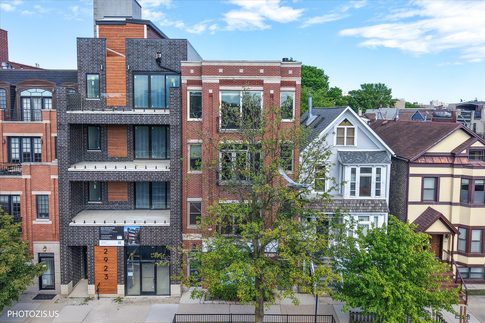 MULTIPLE OFFERS RECEIVED. HIGHEST AND BEST DUE 11a SUNDAY MAY 31. Southport Corridor Penthouse Living  This beautifully updated 3-bedroom, 2-bath penthouse offers modern comfort in one of Chicago's most sought-after neighborhoods. Recent 2026 updates include newly renovated bathrooms, with the primary suite featuring spa-inspired finishes, along with refinished hardwood floors in a light, neutral tone and updated stainless steel kitchen appliances.  Filled with natural light throughout the day and showcasing stunning sunset views, this home blends style, quality, and effortless living. The thoughtfully designed layout creates a seamless flow ideal for both everyday living and entertaining.  This residence also presents a unique opportunity to create your own private rooftop retreat, with exclusive roof rights and the option to build out a deck accessed from the rear balcony.  Parking is a standout feature, with two spaces included-an attached garage space plus an additional tandem exterior spot. Large 1st floor storage closet.   Located within the highly desirable Burley School District and just steps from St. Alphonsus School, this home places you in the heart of Southport Corridor-surrounded by top-rated dining, boutique shopping, coffee shops, and neighborhood parks.  A rare chance to own a move-in-ready penthouse in one of Chicago's most vibrant and established communities. See 3D and other media tour links