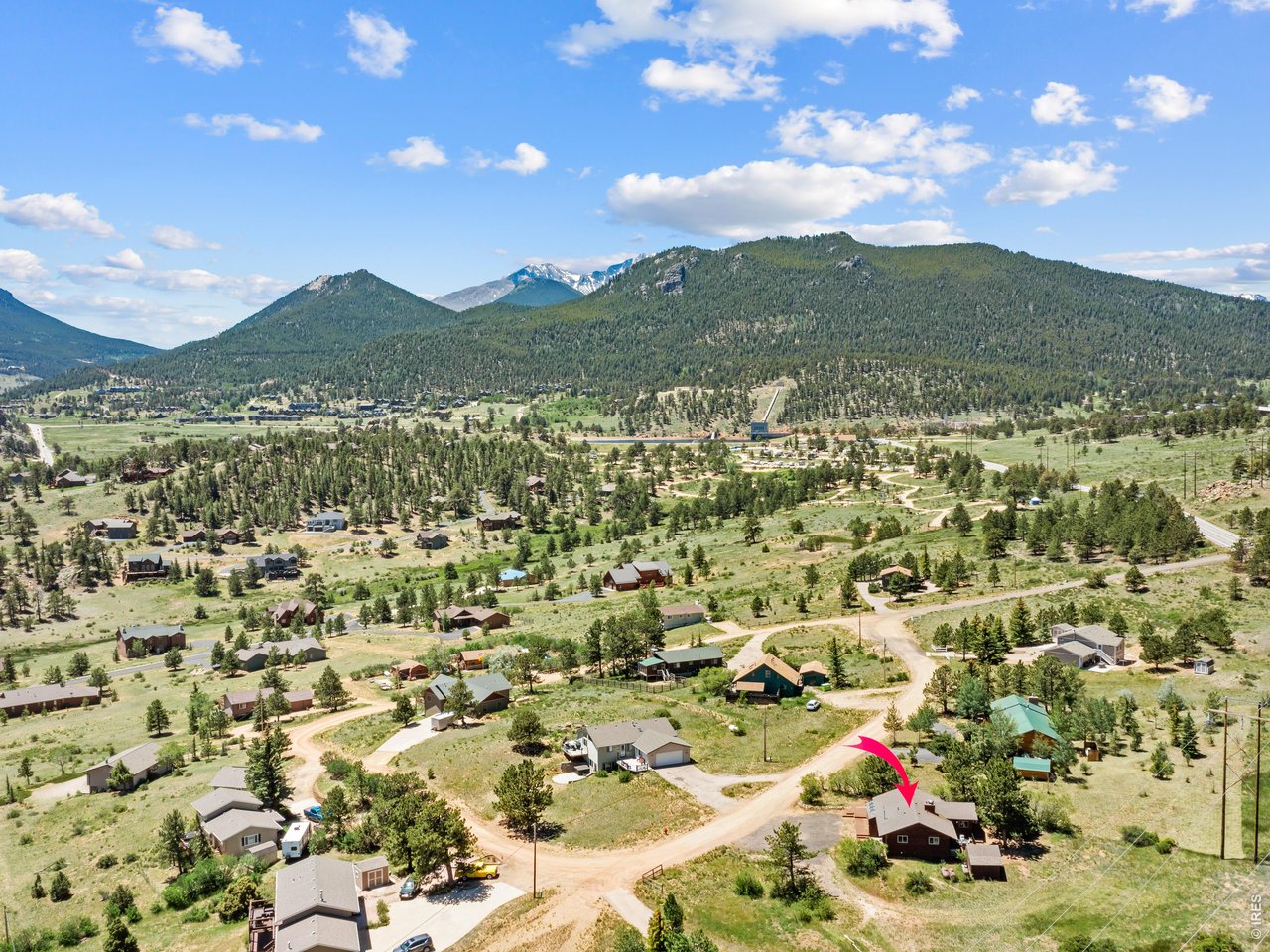 Beautifully updated 2-bedroom, 2-bath ranch home set on .56 acres, just minutes from downtown Estes Park and Rocky Mountain National Park. Offering the ease of one level living, this home features an open layout, beautiful spacious kitchen, newer windows, and a tankless water heater for added comfort and efficiency. Enjoy your morning coffee from the back deck and your evening libations on the front deck! With multiple outdoor spaces to relax and take in the peaceful setting. The sunroom offers a great space for gardening and helps heat the home in the winter. The surrounding property gives you room to enjoy the mountain lifestyle and The Thumb Open Space is just down the road for great hiking with your dog. Located in an area known for frequent wildlife sightings (see herd of elk photo!), this home is ideal as a full-time residence or a second home in Estes Park.
