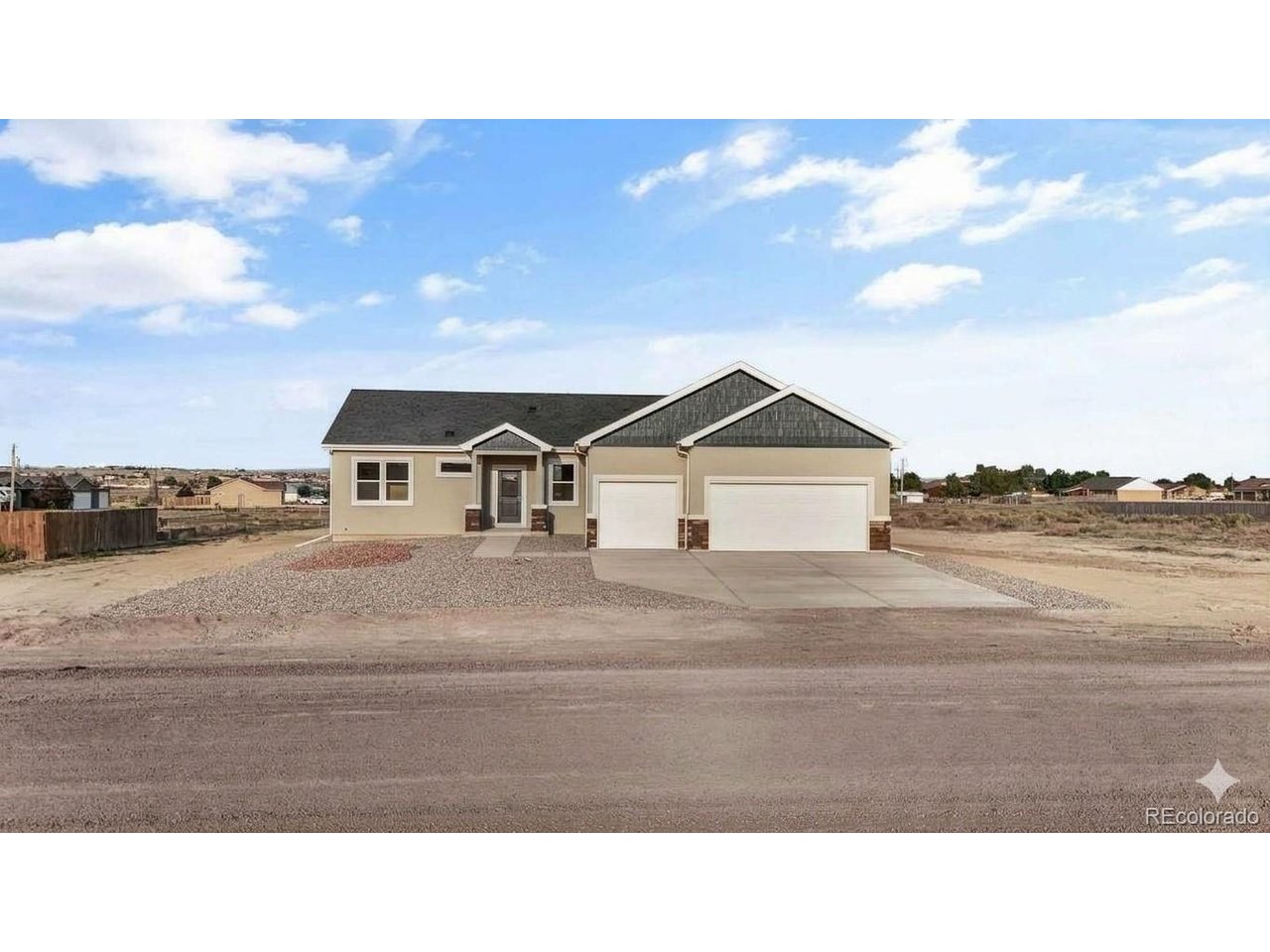 Experience the best of Colorado ranch living in the newly built "Whisper" floor plan! Perfectly situated on a quiet 1.42-acre lot, this stunning 1,904 sq. ft. ranch-style home offers an unmatched blend of modern comfort, energy efficiency, and panoramic mountain views. Minutes from I-25, you are less than 35 minutes from Colorado Springs and only 10 minutes from Pueblo. Inside, the bright, open-concept layout features soaring 9-foot ceilings and a seamless flow ideal for entertaining. The spacious gourmet kitchen boasts gorgeous granite countertops, a large center island, premium stainless GE appliances, soft-close cabinetry, and a walk-in pantry. It opens directly to the expansive living and dining areas, keeping you connected with family and guests. Retreat to the private primary suite-a true oasis featuring a luxurious 5-piece bath complete with a soaking tub, separate walk-in shower, and dual granite vanities. Two additional spacious bedrooms and a full guest bath provide plenty of room for family, guests, or a dedicated home office. Functional interior details include central A/C and a convenient, dedicated mudroom/laundry room. Outside, the home shines with a low-maintenance stucco exterior and a beautifully xeriscaped front yard. The massive 3-car garage provides abundant space for vehicles, storage, or a workshop, while the expansive backyard offers endless opportunities for outdoor play, weekend barbecues, and dedicated RV parking. Designed for peak energy efficiency, this fully electric home keeps your utility costs low while maintaining maximum comfort year-round. Prime location, modern elegance, and breathtaking views-schedule your showing today!