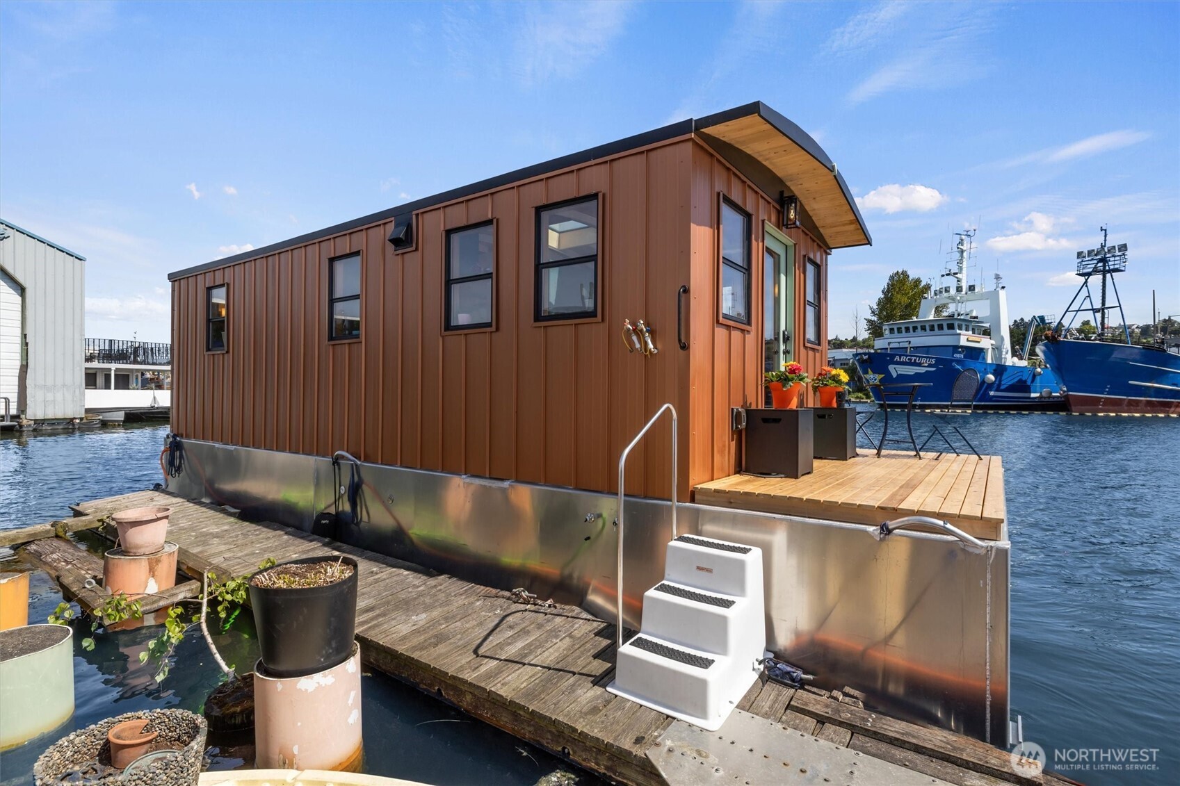 Welcome to Copper Penny, completely renovated in 2025, w/ stunning views down the canal to Lake Union, & quick access to downtown & Ballard. You'll love the exceptional craftsmanship & finish work in this copper-clad gem! Natural light floods the living area w/ hardwood flrs, new windows, large skylight, & a galley kitchen w/ full-sized stainless appliances, new cabinets plus a thoughtful built-in lighted eating bar. Next you'll find the marble-adorned bath w/ full soaking tub & heated floors.  Huge bonus room is the new aluminum hull w/ automatic lighting for you to see the massive amount of storage or active space. Marina boasts free prkg, laundry/bath facilities, kayak stg/launch. Low moorage makes this a hard one to pass up! FOWR 861