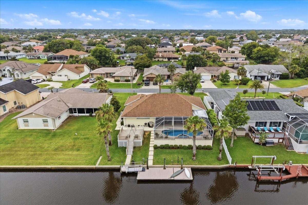 Under contract-accepting backup offers. LIVE THE SALTWATER LIFESTYLE you’ve always dreamed of! This stunning waterfront pool home is perfectly positioned on a spectacular intersecting saltwater canal, offering some of the most breathtaking wide-water views you’ll find in Palm Coast. From the moment you arrive, you’ll be captivated by the endless water vistas, amazing sunsets, and the daily parade of dolphins and manatees right from your backyard.Currently operating as a successful Airbnb, this meticulously maintained 3-bedroom, 2-bath home is truly move-in ready and offers the perfect blend of luxury, relaxation, and investment potential. Designed to embrace Florida living, the open-concept floor plan features triple disappearing sliders that completely open the home to the oversized screened lanai and sparkling pool, creating an entertainer’s paradise where indoor and outdoor living become one.   The beautifully updated kitchen boasts white cabinetry, solid surface countertops, stainless steel appliances, and a breakfast bar overlooking the water. The spacious primary suite offers a private retreat with an upgraded spa-like bath designed for comfort and relaxation.   Boating enthusiasts will fall in love with the 30’ x 12’ dock complete with water and electric, Trex decking, bulkheaded seawall, and quick access to the Intracoastal Waterway. Located just 200 feet from the canal tip, you’ll spend less time navigating and more time enjoying life on the water.   Recent improvements include a NEW AC in 2024, roof in 2014, and Trex dock and deck replacement in 2014.  And the best part? NO HOA! Bring your boat, your toys, and your waterfront dreams. Located just minutes from the marina, only 15 minutes to the sandy shores of Flagler Beach, and close enough to bike to the shops, restaurants, and entertainment of European Village. Whether you’re searching for a full-time residence, vacation getaway, or income-producing property, this home delivers the ultimate Florida waterfront experience.   Opportunities like this are rare—spectacular views, saltwater access, a sparkling pool, and NO HOA. Don’t just buy a home… embrace a lifestyle!