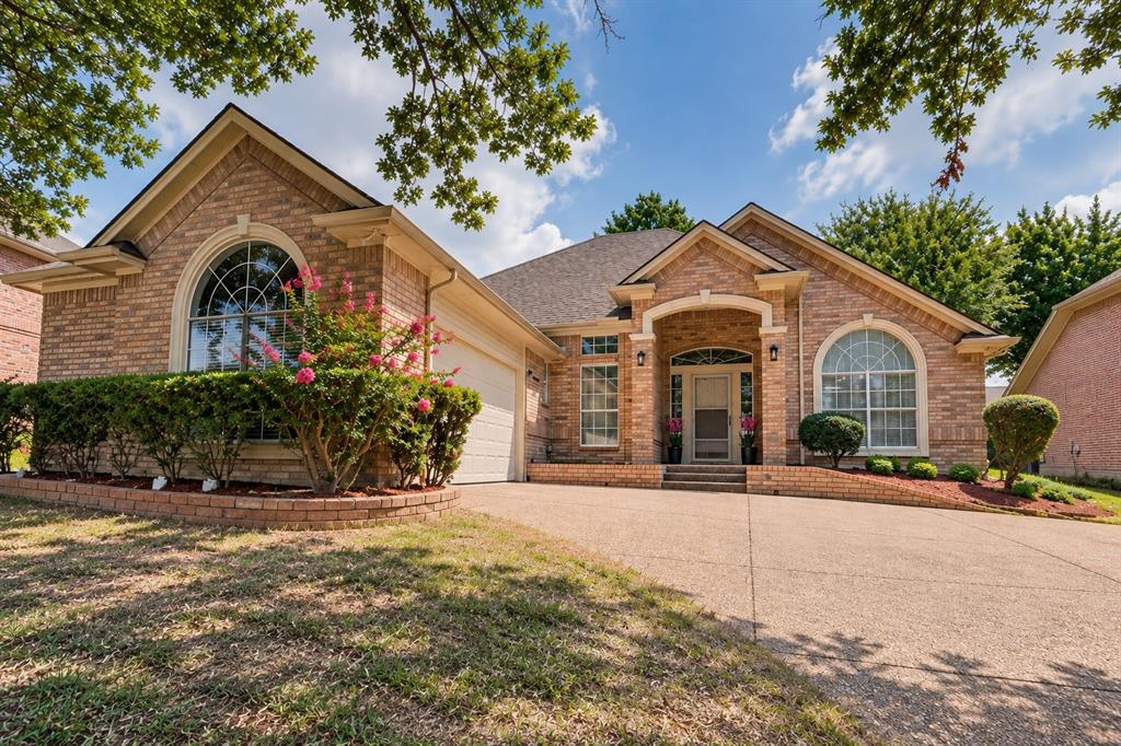 OPEN HOUSE SUNDAY 2-4 PM!!!   Stunning updated custom home in sought-after River Forest, offering an exceptional combination of style, space, and natural light. The bright, open floor plan features oversized rooms and extensive updates, including fresh interior paint throughout, designer lighting, wood-look laminate flooring with no carpet, and beautifully updated bathrooms.The expansive living room is anchored by a striking fireplace and enhanced by custom millwork and crown molding, creating an inviting space that flows seamlessly into the kitchen and breakfast room. The beautifully appointed kitchen features granite countertops, a large center island, glass-front cabinetry, abundant storage, and a built-in desk ideal for everyday organization. An adjoining sun-filled breakfast room is surrounded by windows and features charming window seats on two sides with views of the spacious backyard.The impressive formal dining room showcases a picturesque double-wide arched window and vaulted ceiling. Retreat to the generously sized primary suite, privately positioned with serene backyard views, an enormous walk-in closet, and a beautifully updated bath. The spa-inspired primary bath features separate vanities, a seated dressing area with mirrored cabinetry, a jetted soaking tub, and an oversized walk-in shower finished with stunning designer tile.Spacious secondary bedrooms are thoughtfully separated from the primary suite. Additional highlights include a large utility room and a swing, side-entry garage that enhances the home’s impressive curb appeal.Outside, enjoy a large fenced backyard and expansive covered patio with updated ceiling fan and lighting—perfect for relaxing or entertaining. Ideally located near shopping, dining, highly rated schools, and DFW International Airport, this beautifully updated custom home offers space, style, and an outstanding location.