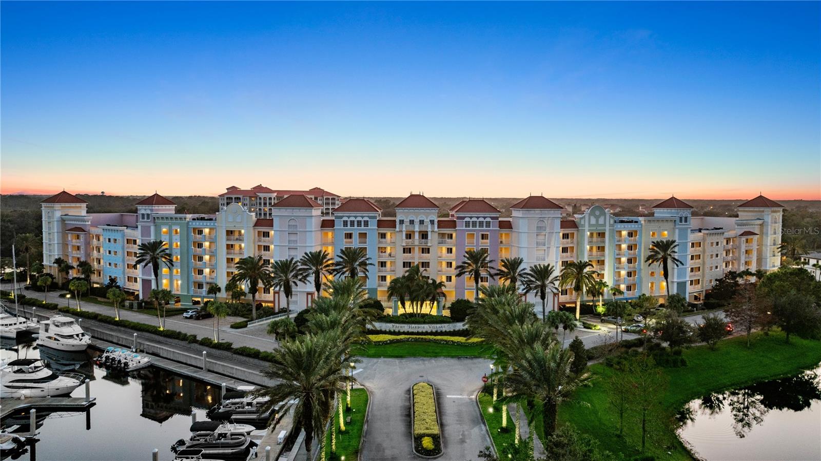 Rental-Ready Waterfront Condo in Palm Coast's Gated Marina Community! Fourth-floor water views and fully furnished - Unit 478 at Yacht Harbor Village puts you directly on the Intracoastal Waterway inside a gated luxurious community, with the Atlantic just beyond.The private covered balcony is the centerpiece — wide water views past the palms, boats cruising by and open sky to the west for stunning sunsets. Sliding doors bring that view into both the living room and the dining area, so the water is part of the room rather than something you step outside for.Inside, 1,351 square feet lives larger than the number suggests. Tray ceilings with crown molding, tile through the main living areas and a smart split layout place the two bedroom suites on opposite sides of the home — ideal for guests, for a work-from-anywhere setup or for rental guests who want their own space.The kitchen comes equipped and ready to cook in, finished in granite with a raised breakfast bar open to the living room, built-in oven and separate cooktop, plus a pantry and full-size side-by-side refrigerator tucked into their own alcove. The living room includes a granite beverage center with sink and cabinetry. The dining table seats six beneath a chandelier. The primary suite offers a soaking tub, separate glass shower, dual vanities and bay windows framing the greenery; the second suite has its own full bath. A dedicated laundry room with full-size washer and dryer sits just off the entry.The residence has an established history in the on-site rental program and continuing with it is simply an option the new owner can take up if they'd like.Yacht Harbor Village delivers the marina lifestyle at ICW Mile Marker 803, with slips from 30 feet to over 100, a waterfront pool and spa overlooking the Intracoastal, fitness center, tennis and pickleball courts, waterfront dining, tiki bar, ship's store and concierge service. Optional membership to Hammock Beach Golf Resort & Spa is available, opening access to oceanfront pools, championship golf, waterfront dining, tennis, spa, fitness facilities and private beach access.St. Augustine is about 30 minutes north. Daytona Beach and Jacksonville are each within an hour. European Village dining and shops are minutes away. Schedule your exclusive tour today to see what could be yours!