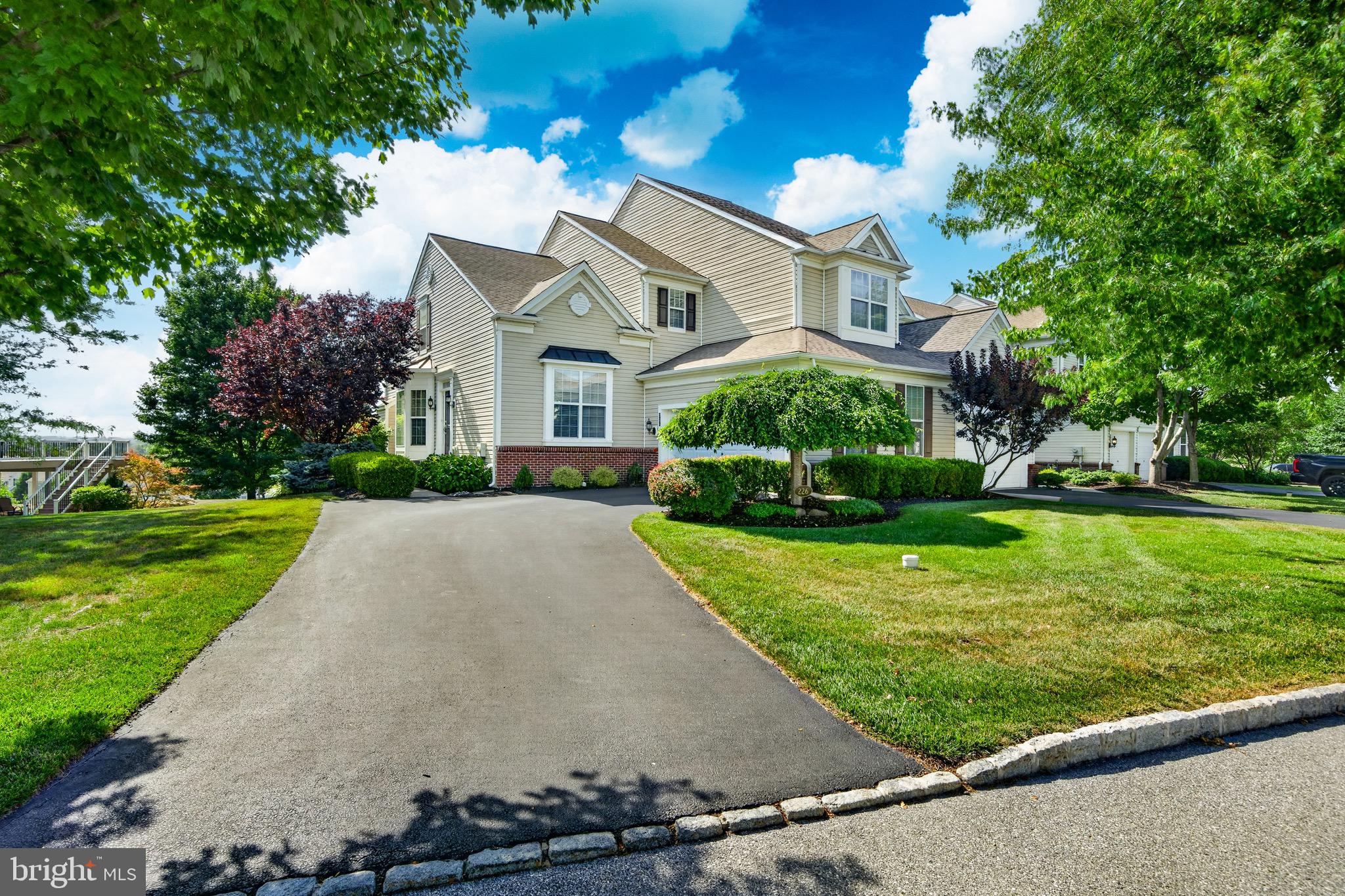 This is truly a unique opportunity to be part of an exclusive and limited enclave of townhomes - they don't make them like this anymore! Resembling the carriage homes in the community, these "mini carriage homes" are the original Applecross townhomes and come with fine detail and all the bells and whistles! This rare and highly desirable Deerfield model end-unit, with an unbeatable location in the heart of Applecross , is one of Applecross’ most sought-after townhome models and is the only model that features a first-floor master suite! As you enter, the living room astounds, boasting beautiful crown molding and architectural pillars, setting the stage for what is to come. The beautiful kitchen is spacious yet efficient, with glistening granite countertops extending to the sit-at breakfast bar. The premium cabinetry perfectly complements the stainless steel appliances. The family room boasts a dramatic two-story vaulted ceiling with recessed lighting and a huge wall of windows that bathe the room in natural light. The cozy gas fireplace with decorative shadow boxes sets the mood, or take the party outside with sliders that lead to the large maintenance-free deck overlooking breathtaking views of the Chester County countryside.  Back inside, the convenience of the first-floor master bedroom suite featuring a tray ceiling and back views cannot be overstated. The primary bath offers a tile stall shower and the double vanity is clean and crisp. The large soaking tub awaits after a long day. Upstairs, you’ll find a gorgeous loft area that is extremely spacious and offers versatile flex space that is perfect for an additional sitting area/second living room. The second and third bedrooms are quite large, include two ample sized closets in each bedroom, and share a Jack-and-Jill bathroom with double vanity and tile shower/tub. The basement is quite large, offering plenty of storage opportunities and ready for you to finish! The attached, large, 2 car garage provides more storage opportunity while the large driveway accommodates additional off street parking. This townhome is located in the heart of Applecross. The superb location is stone throw away from the pools and fitness center and super close to the golf course and walking trails. The location is perfect!Applecross Country Club is conveniently located near several parks, as well as shopping and restaurants! Also conveniently located near major travel routes, including the Downingtown and Thorndale Train Stations, Route 322, Route 30, and Route 100 as well as the Pennsylvania Turnpike. Enjoy the award-winning Downingtown School District and take advantage of all that Applecross offer: A state of the art fitness center and the -Studio T- exercise/dance studio, indoor and outdoor pools, Caribbean pool bar, Nicklaus-designed golf course, tennis, fitness classes, social events/parties, full restaurant/bar, family events, basketball and more! Applecross - Live Where You Play! This is a must-see home.