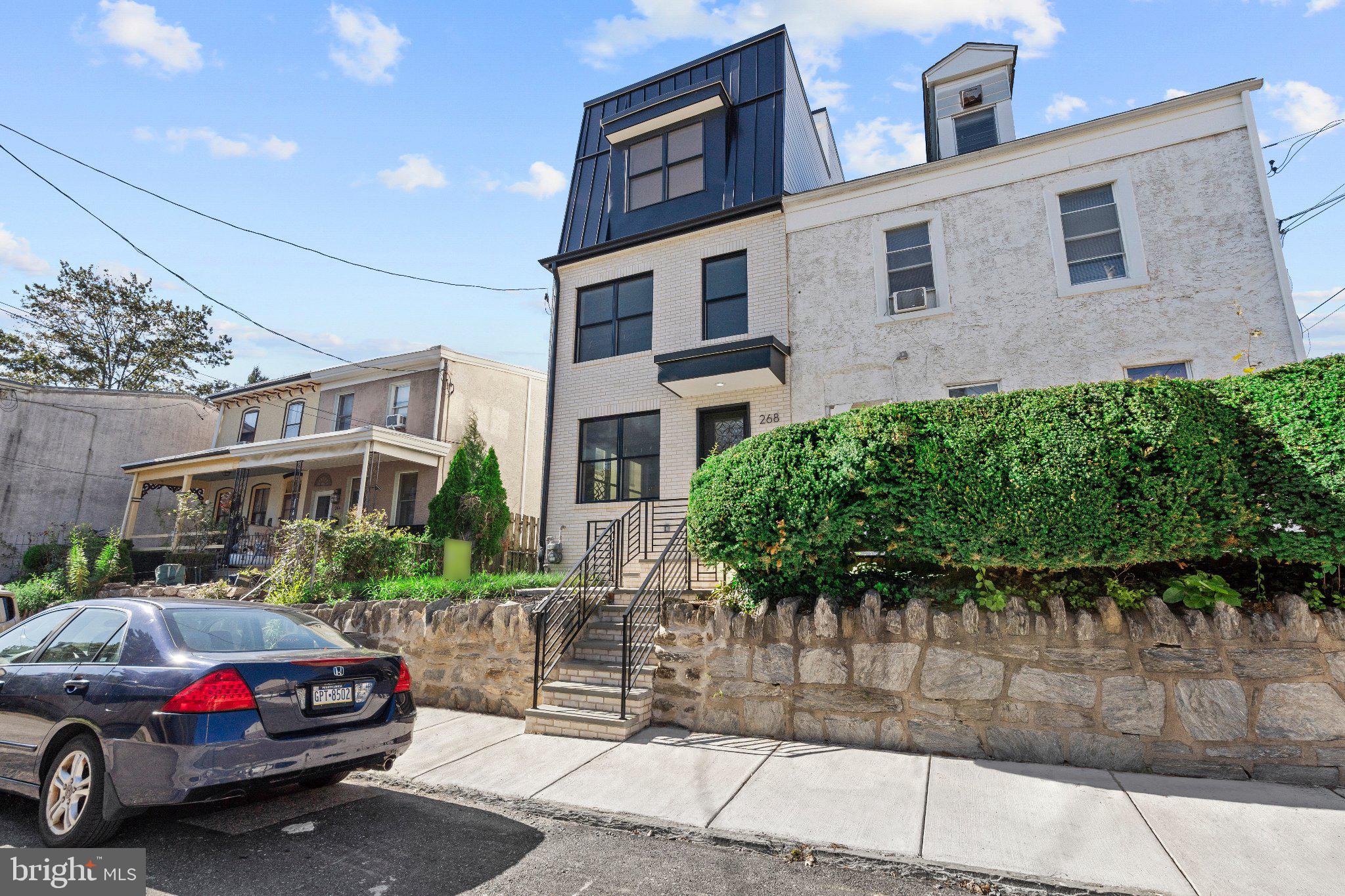 Welcome to this exceptional new-construction home in the heart of Manayunk, where sophisticated design, luxurious finishes, and thoughtful functionality come together to create an extraordinary living experience. Offering 4 bedrooms, 3.5 bathrooms, 3 private parking spaces, and an expansive 752-square-foot rooftop deck, this beautifully designed residence provides an impressive combination of indoor and outdoor living.The FIRST FLOOR features a bright, spacious open-concept floor plan with a welcoming living room, gourmet kitchen, powder room, and comfortable family room highlighted by a gas fireplace. Sliding glass doors provide convenient access to the rear parking area. The stunning kitchen is designed for both everyday living and entertaining, featuring a large center island, elegant quartz countertops, and stainless-steel appliances.The SECOND FLOOR is dedicated to an impressive primary suite. The generously sized bedroom offers separate his-and-hers closets and a luxurious en-suite bathroom. The spa-like bath features a walk-in shower with multiple shower heads, a deep soaking jetted tub, and a double vanity—creating a private retreat at the end of the day.The THIRD FLOOR offers two additional spacious bedrooms, a beautifully appointed full hall bathroom with double vanity and walk-in shower, and a conveniently located laundry area.Take entertaining and relaxation to the next level on the spectacular 752-square-foot rooftop deck, where sweeping views provide the perfect backdrop for morning coffee, evening cocktails, entertaining guests, or simply enjoying the city skyline.The LOWER LEVEL provides versatile additional living space, featuring a private steam room, sitting/flex room, fourth bedroom, and full bathroom with walk-in shower. This level offers exceptional flexibility for guests, a home office, recreation space, or extended living arrangements.Additional features include two brand-new gas HVAC systems, solid hickory hardwood flooring throughout the main living areas, luxury vinyl plank flooring on the lower level, and three private parking spaces—a highly desirable feature in Manayunk.Ideally located in one of Philadelphia’s most vibrant and sought-after neighborhoods, this home provides easy access to the Schuylkill River Trail and Tow Path, popular restaurants, cafés, shopping, entertainment, and public transportation. Enjoy the best of Manayunk while being just minutes from Center City and major transportation routes.One of the home’s most significant advantages is the 10-YEAR TAX ABATEMENT, offering a tremendous opportunity for buyers to enjoy the benefits of brand-new construction with potentially significant property-tax savings.A truly special new-construction opportunity offering luxury, space, parking, spectacular outdoor living, and exceptional tax savings in the heart of Manayunk.