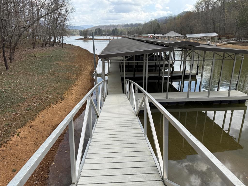 If you are looking for a level lake lot to build your dream home on with paved gated access and Nice large trees this is a beautiful lot in a beautiful neighborhood. The lot is 1.27 acres and THE ABOVE DESCRIBED LOT IS CONVEYED together with the exclusive right and use of Boat Slip No. 1 o f the boat dock within Cypress Pointe At Lake Chatuge Subdivision,