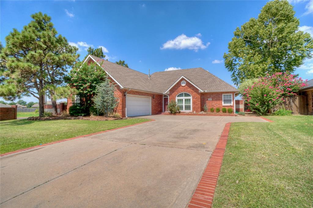 Motivated Seller!.  $5000 closing cost or updates. 3 bed with 2 living and dining areas.  Cozy fireplace in living room for cold winter nights.  Spacious 13x18 Master suite has 2 huge walk in closets, whirlpool tub & and separate shower.  Wood floors and brick pavers..  Upstairs bedrooms are spacious and second living area makes great movie room..  Zoned heat and air.  Plantation shutters,  lot of built-ins and beautiful cabinetry. Pantry, Sink in utility room and also in hobby room in garage.  There is a second garage/workshop attached in the back with separate driveway and overhead door that has a sink and built-ins.  Vinyl trim so easy maintenance,  Covered patio and professionally landscaped.