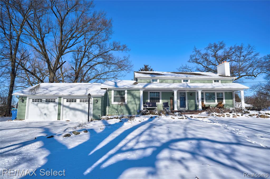 Experience refined lake living with this beautifully maintained home, offering deeded access to sought-after Lake Fenton, the largest lake in Genesee County. The property includes a shared dock space (one of six) with a newer docking system, providing effortless access to boating and waterfront enjoyment. This stunning property offers an exceptional blend of modern updates and lakeside living. Meticulously updated from top to bottom, the home showcases high-quality finishes and thoughtful upgrades throughout.The inviting kitchen is a chef’s dream, featuring rich cherry cabinetry, luxurious granite countertops, premium stainless steel appliances, and heated ceramic flooring for added comfort and style. The primary bedroom is conveniently located on the entry level and features a spacious walk-in closet with washer and dryer hook-up. The primary bath offers a double vanity for added comfort.An inviting living room showcasing a stunning fireplace, surrounded by built-in shelving, beautiful hardwood floors and a large window that fills the space with natural light. Upstairs, you’ll find two generously sized bedrooms with charming lookout windows and a full bath. The finished, walkout lower level is perfect for entertaining, offering a spacious rec room with a gas fireplace, an office or potential 5th bedroom, and a full bathroom. The home is thoughtfully enhanced with a whole-house generator, brand-new central air installed in 2024, and a whole-home arsenic and heavy-metals filtration system added in 2024—offering exceptional comfort, reliability, and peace of mind.