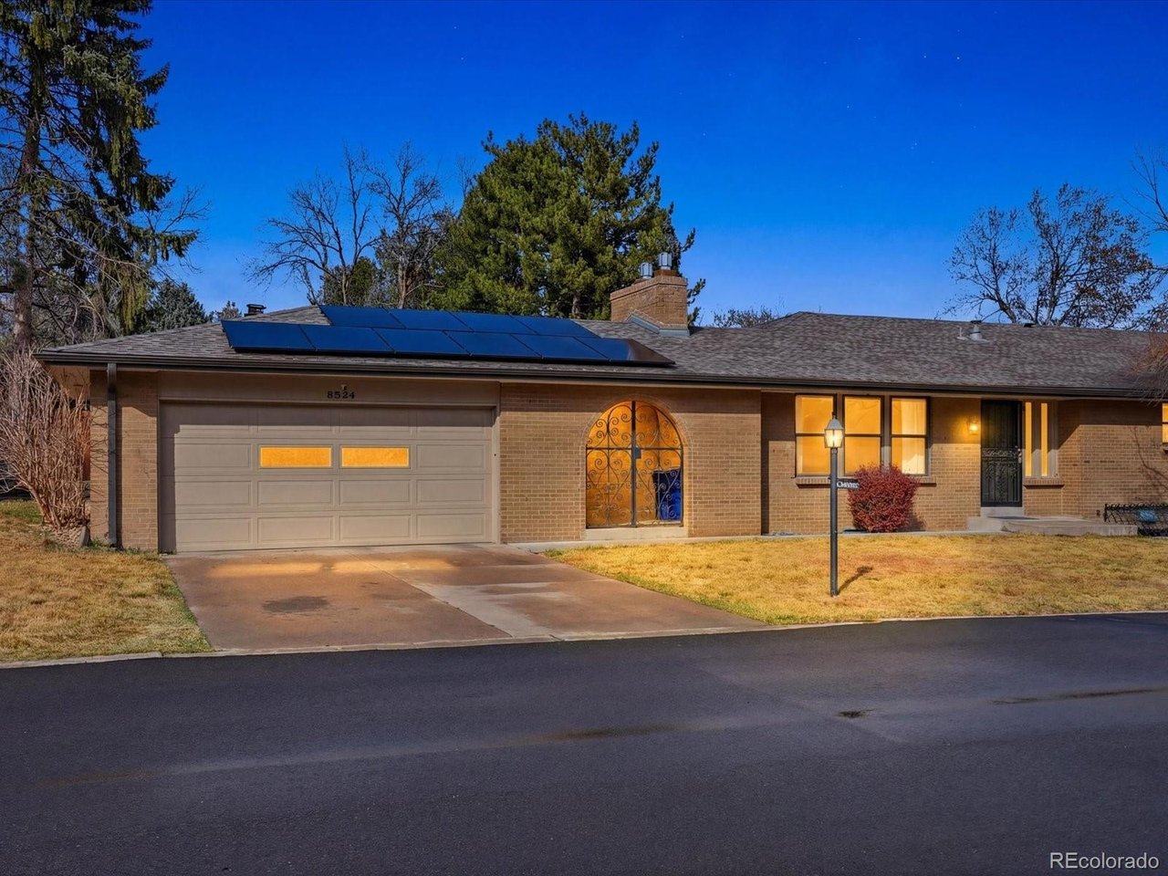 WOW!  What an incredible opportunity on this rare ranch style duplex in Lakewood Green.  The upstairs has been tastefully remodeled with a spacious, updated kitchen offering a full stainless steel Kitchen Aid appliance package with induction cooktop.  Quartz counters, custom tile, skylight, large pantry, eat in seating, and plenty of cabinet space, make this a chef's dream.  Beautiful laminate flooring, warm colors, and washer/dryer are included.   Once downstairs, you're greeted with another open concept area and possible mother-in-law space with kitchenette & appliances, gas fireplace, built in bookshelves, widescreen TV, washer/dryer, full bath, and 2 conforming bedrooms with egress windows!  There is a 2 car heated garage w/storage, a fenced backyard for BBQ's or your furry friend!  Sprinkler system in both the back and front yard, and a Central Air conditioning system will keep you cool in the summer.  The 4.1 KW Solar System is fully owned and will help cut energy costs to a fraction of what they'd be otherwise.  Lakewood Green is impeccably maintained, and offers mature trees, beautiful landscaping, a quiet/cozy setting, and well run HOA.  Perfectly located just minutes from the mountains or downtown Denver.  Light rail is an easy walk, and the area has plenty of great shops & restaurants nearby.  This is a true opportunity in a great complex!  Lot's of possibilities here.  Call or text David today for your own private showing at 720-854-9501.