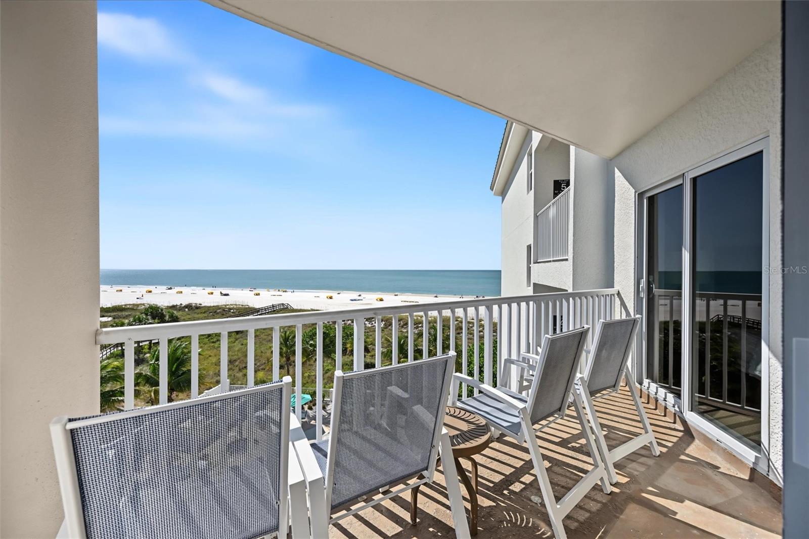 Enjoy the best of both worlds at Sunset Vistas Beachfront Resort, where you can escape to the beach with family and friends while generating rental income when you're not using your property. Occupying one of the most coveted locations at Sunset Vistas, Unit 513 South is perfectly positioned closest to the beach on the south side of the building. This exceptional location offers breathtaking panoramic coastal views extending from Treasure Island along St. Pete Beach toward Egmont Key. With no neighboring balconies directly in front of you, enjoy an added sense of openness and privacy from your own private balcony. Opportunities to own a unit in this highly desirable location rarely become available. Imagine beginning your mornings with warm southern sunshine, gentle Gulf breezes, and panoramic coastal scenery, then enjoying the comfort of afternoon shade from your private fifth-floor balcony. Whether relaxing with your morning coffee, watching boats offshore, or taking in the beautiful Florida coastline, this exceptional setting captures everything that makes a Treasure Island beach getaway so special. Offered fully furnished and turnkey, this inviting two-bedroom, two-bath condominium features an open-concept living and dining area, a fully equipped kitchen with white cabinetry, granite countertops, stainless steel appliances, and a breakfast bar. Luxury vinyl flooring, comfortable furnishings, and abundant natural light create a welcoming coastal atmosphere. Sliding glass doors connect the living area to the private balcony, while the primary suite also enjoys balcony access and beautiful Gulf views. The second bedroom provides comfortable accommodations for family and guests, and an in-unit washer and dryer adds everyday convenience. For buyers seeking a beachfront vacation rental investment, a personal beach retreat with income potential, or a 1031 exchange opportunity, Unit 513 South offers an exceptional combination of location, lifestyle, and documented rental history. Gross rental income totaled $71,692 in 2021, $86,919 in 2022, $91,292 in 2023, $77,289 in 2024, and $78,388 in 2025, with an additional $60,627 recorded from January through September 2026. Sunset Vistas Beachfront Resort is a popular Gulf-front condominium-hotel community located directly on the sugar-white sands of Treasure Island Beach. Resort-style amenities include a large beachfront swimming pool and spa, a separate children's pool with fountains, beachfront tiki bar, café, fitness center, and convenient beach access. Ideally located near John's Pass Village and Boardwalk, owners and guests can enjoy waterfront dining, boutique shopping, boating excursions, fishing, and entertainment just minutes away. An assigned under-building parking space adds convenience to this exceptional beach retreat. Whether you're looking for a Florida Gulf Coast vacation property to enjoy with family and friends, an income-producing short-term rental, or a combination of both, Sunset Vistas Unit 513 South offers a rare opportunity to own one of the resort's most desirable south-side locations. Schedule your private showing and discover what makes this beautifully positioned premium Gulf of Mexico view unit so special.