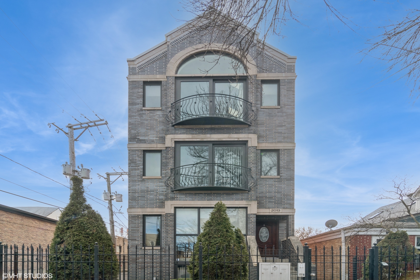 This top floor sun filled 2 bed, 2 bath condo in Ukrainian Village delivers the unexpected, starting with vaulted ceilings and skylights that flood the space with natural light. This spacious home features hardwood floors that run throughout and a wood-burning fireplace with a gas starter-perfect for cozy nights in. The kitchen serves up a sleek, contemporary vibe with stainless steel appliances and plenty of space to cook or casually impress. Tucked in an intimate 3-unit building, it offers a rare sense of privacy and community. You have a choice of 3 options for enjoying your outdoor space- step out onto your Juliet balcony for that morning cup of Joe, entertain on the spacious back deck where you can also practice your gardening skills or head up to your private rooftop oasis to take in scenic skyline views. One garage parking spot and 2 personal storage closets included. Just minutes to the convenience of Chicago Ave and a short stroll to the buzz of  Division Street in Wicker Park where local boutique finds, chef driven dining and city energy meet in all the right ways. This is the one that makes you rethink what's possible...
