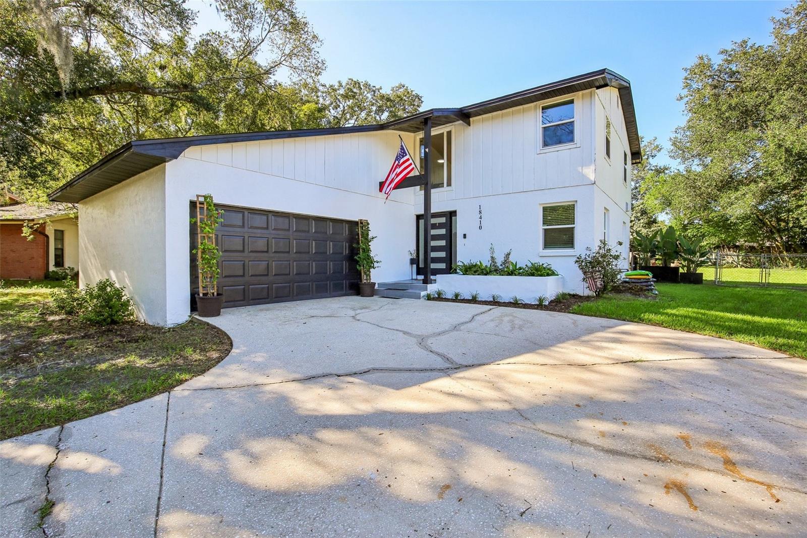 Welcome to this charming, updated 3-bedroom, 2.5-bathroom home in the highly desirable Lutz area! Featuring a comfortable open-concept layout and a kitchen with sleek quartz countertops, this home blends comfort with contemporary style. Luxury vinyl flooring flows seamlessly through the family room, kitchen, and dining area. The spacious primary suite offers a generous walk-in closet and a private balcony overlooking the beautiful backyard and sparkling pool. Newly replaced insulation, new impact windows, and French and sliding doors add energy efficiency and peace of mind for years to come. Step outside to a spacious backyard, an inviting pool, and a covered back porch, perfect for morning coffee or afternoon relaxation surrounded by serene natural views. Just minutes from major roads, this home offers the ideal balance of tranquility and convenience in a prime location. Move-in ready, this gem won't last long. Schedule your showing today!
