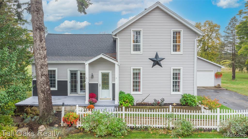 Welcome to this stunning farmhouse in Davison, set on 19.33 acres. Blending charm with contemporary updates, this 4-bedroom home offers space, character, and comfort both inside and out. The layout includes 2 bedrooms on the upper level and 2 on the lower level, with the primary suite located upstairs for added privacy. The 4th bedroom, currently used as a home office, features a sliding door that opens to the outdoors. Large windows throughout the home fill the space with abundant natural light, creating a warm and inviting atmosphere. The updated kitchen is perfect for cooking and entertaining, while the first-floor bathroom features a soaking tub and a modern tiled shower for a spa-like experience. Additional highlights include a detached garage with a wood burner, ideal for storage, hobbies, or a workshop. A new roof installed in 2024 ensures peace of mind for years to come. This property offers the perfect mix of comfort, character, and open space.