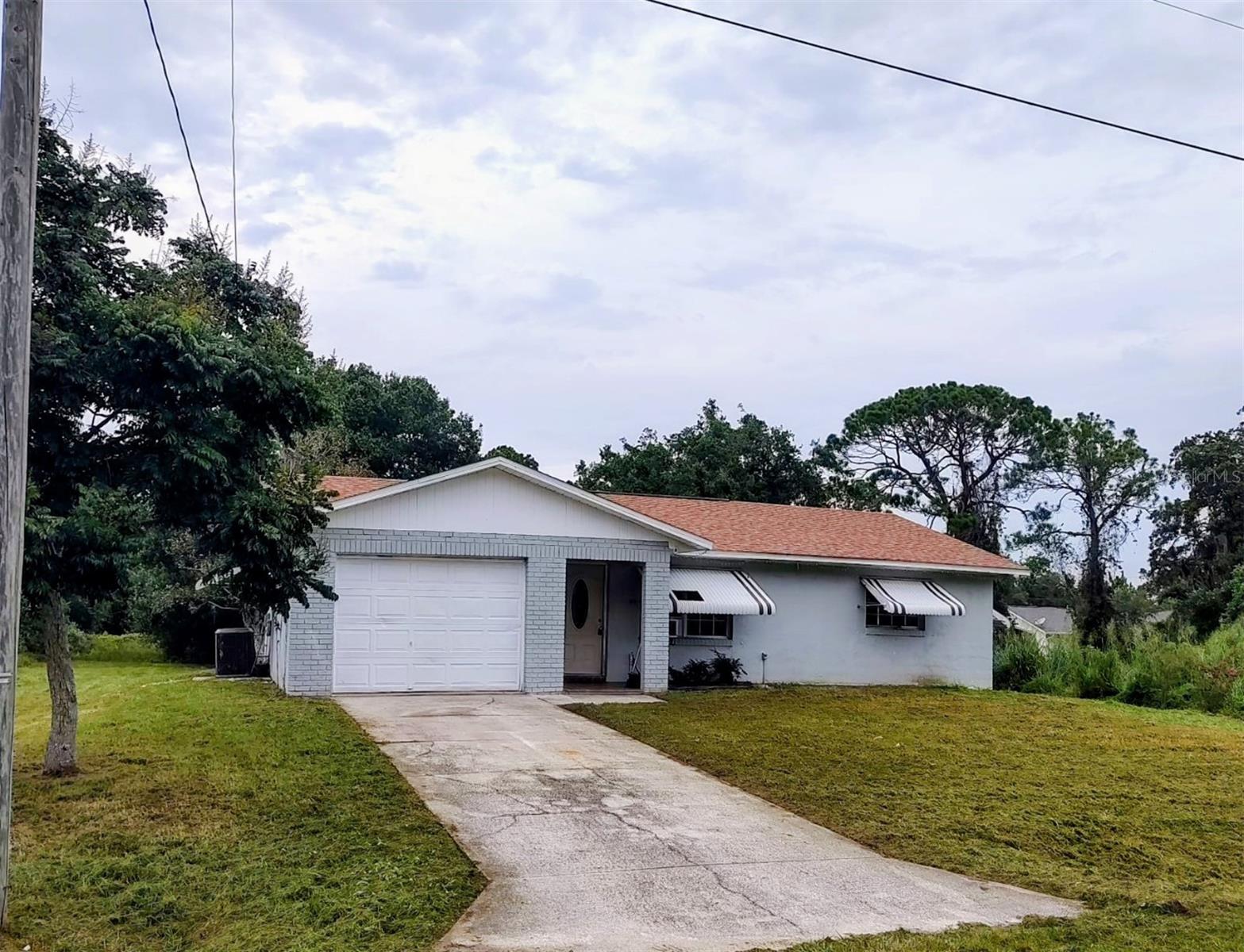 INVESTOR ALERT! Here’s your chance to turn a fixer-upper into a profitable investment in desirable Placid Lakes! This 2-bedroom, 2-bath concrete block home sits on approximately 1/4 acre along a county-maintained graded road, offering privacy with no immediate neighbors. The home features tile flooring throughout and solid block construction, making it a great candidate for renovation and transformation. Whether you're looking for your next flip, rental opportunity, or affordable project, this property offers plenty of possibilities. Enjoy the added appeal of Placid Lakes and access to Lake June through August Tobler Park off Catfish Creek Road. Bring your contractor, bring your vision, and unlock the potential! Property is being sold AS IS, ask your agent for more details.