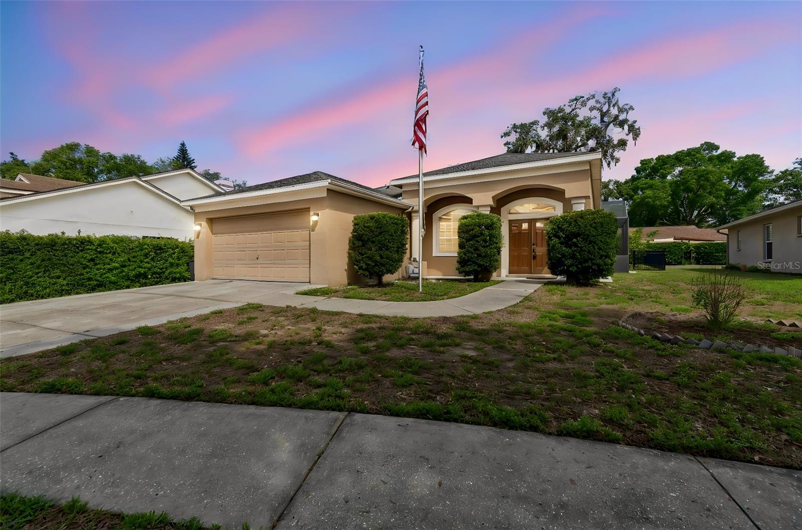 Florida paradise! Welcome home to this impeccably clean, spacious 3-bedroom, 2-bathroom sanctuary. It is designed to satisfy even the most discerning buyer. Located in a highly sought-after golf community with remarkably low monthly HOA fees, this property perfectly blends luxury, comfort, and convenience.Elegant Flooring flow seamlessly throughout the entire layout. Dramatic tray ceilings add architectural depth. BIG Kitchen with Expansive countertops and abundant storage make meal preparation a breeze. Inside Laundry room! Master Suite, Features striking architectural pillar accents and premium custom upgrades: Every secondary bedroom offers oversized dimensions and deep closets!  OUTDOOR LIVING & PRIVACY features a high-grade composite ceiling with Sun Protection. A premium, durable wrought-iron fence encloses the manicured backyard.  Thoughtfully landscaped borders offer a peaceful, quiet sanctuary. Quick, effortless access to the international airport. Located just minutes from local schools.Seamless proximity to premier shopping plazas, dining, and entertainment.