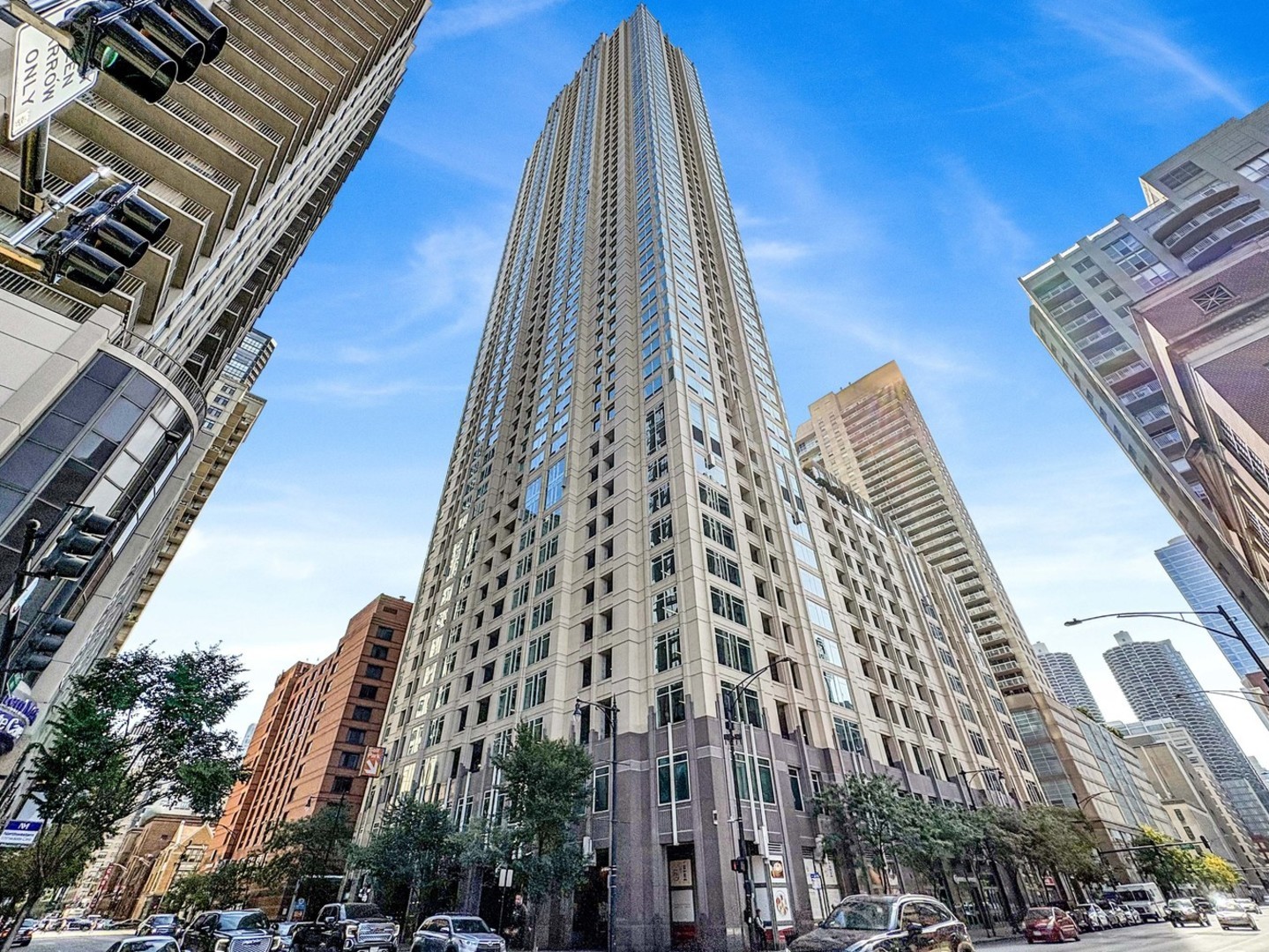 Welcome to this beautifully renovated 2-bedroom, 2-bath residence in one of River North's premier full-service high-rises. Designed for modern living, this spacious home features an open floor plan with exceptional flow and stylish, high-end finishes throughout. The sleek white kitchen is a chef's dream, featuring stainless steel appliances, custom lighting, and an oversized island that offers extra seating and prep space-perfect for entertaining. Updated flooring runs throughout the entire unit, complemented by Hunter Douglas automatic custom window treatments for added comfort, privacy, and style.The oversized primary suite is a true retreat, offering expansive his-and-hers professionally organized closets and a spa-inspired en-suite bath with dual vanity, soaking tub, and elegant marble tile. The spacious second bedroom is perfect for guests or a home office, and the updated guest bath features modern finishes.This home also includes in-unit washer/dryer, generous storage, and a storage locker. One parking spot available for an additional $25,000.Enjoy full access to premium building amenities: 24-hour door staff, package delivery to your door, fitness center, pool, sundeck, party room, conference room, and on-site dry cleaners.Located in the vibrant heart of River North, you're just steps from the Magnificent Mile, Nordstrom, Eataly, Whole Foods, Trader Joe's, and some of the city's best dining and shopping. With a Walk Score of 99 and easy access to the Loop, public transit, and expressways, this is true city living at its finest.