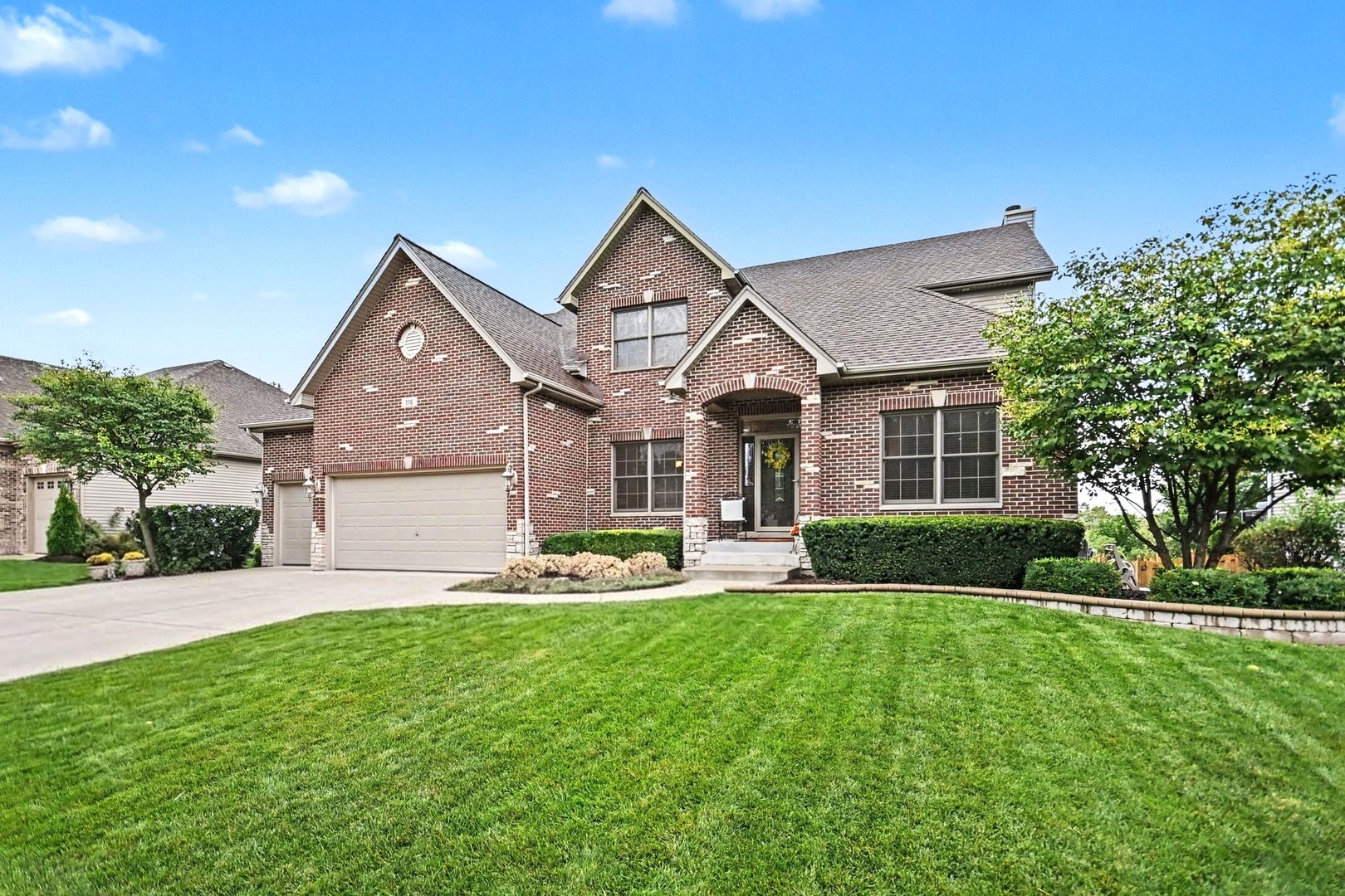 Set against the serene backdrop of open prairie in the highly desirable Deerpath Trails community, this exceptional residence offers a rare combination of space, privacy, and refined living. Offering approximately 3,100 square feet above grade, this impressive home features four oversized bedrooms, three full baths plus one-half bath, plus two additional bedrooms and a full bath in the professionally finished basement-providing an extraordinary level of space and versatility. The open-concept main level is enhanced by 9-foot ceilings and rich hardwood flooring, creating an inviting sense of scale and effortless flow. At the heart of the home, the beautifully appointed kitchen blends style and function with upgraded maple cabinetry, granite countertops, stainless steel appliances, a spacious center island with seating, and a walk-in pantry. A new KitchenAid cooktop added in 2025 further complements this well-designed culinary space. Generously proportioned bedrooms offer exceptional comfort, while the primary suite provides a true retreat. Its luxurious private bath features a large walk-in shower and Jacuzzi soaking tub, creating the perfect place to unwind. The professionally finished lower level expands the home's possibilities with impressive 9-foot ceilings, two additional bedrooms, a full bathroom, and abundant space for entertaining, recreation, a home theater, fitness area, office, or guest accommodations. Equally impressive is the home's outdoor setting. The professionally landscaped property backs directly to open prairie, offering a rare sense of privacy, serenity, and unobstructed views. A TREX composite deck provides the ideal setting for outdoor dining and relaxation, while an irrigation system, updated landscaping, and retaining wall enhance the beautifully maintained grounds.  Extensive improvements reflect exceptional pride of ownership, including new roof (2026), two new furnaces and two new air-conditioning units (November 2022), TREX composite deck (2019), new concrete driveway, walkway, porch and steps (2022), new KitchenAid cooktop (2025), new main sump pump and battery for backup (2026), and updated tile flooring in the laundry room (2018). Ideally located near highly regarded schools, charming downtown Oswego, dining, shopping, parks, scenic walking paths, and everyday conveniences, this remarkable Deerpath Trails residence offers an exceptional combination of space, privacy, thoughtful updates, and timeless appeal. A truly special home that must be experienced in person.