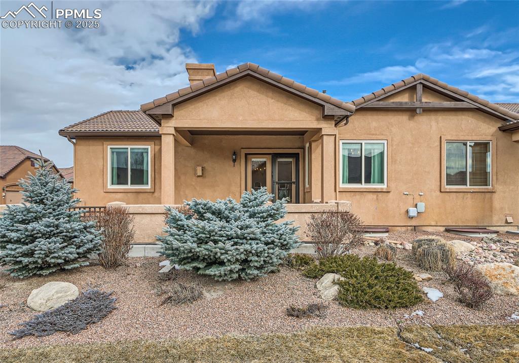 Flying Horse Gem! Low Maintenance, Resort Style Living at its Finest in this Beautifully Maintained Home * Experience exquisite luxury living in this beautifully appointed 4-bedroom, 3-bathroom residence just minutes from I-25, NEW KING SOOPERS & Air Force Academy * Stunning interior boasts an exceptional floor plan & designer finishes thru-out * Step inside to an inviting open-concept featuring generous vaults, rich 5” wood plank flooring, custom trim carpentry, wainscoting, crown molding & striking stone-surrounded gas fireplace—perfect for cozy Colorado evenings * The gourmet kitchen is a chef’s dream, complete with granite countertops, a gas range, stainless steel appliances, a large kitchen island & charming breakfast nook with lots of light * French glass door leads to expansive 14’ x 28’ covered outdoor patio with privacy wall—ideal for entertaining & grilling year-round * Gas stub for grill a plus * Main-level primary suite is private with spa-like en-suite bath, dual vanities & spacious walk-in closet * Secondary bedroom/office conveniently located on the main lvl * Fully finished basement extends your living space with two additional bedrooms, full bathroom & generous entertainment area—perfect for movie nights or Sunday football gatherings * Additional highlights include upgraded heating, central air conditioning, whole-house humidifier, upgraded lighting, decorative metal balusters & built-in window seat with under-seat storage * The attached garage and dedicated laundry room with overhead cabinetry add convenience and functionality * Don't miss this opportunity to own a spectacular, move-in-ready home in one of Colorado Springs' most coveted Country Club Communities * Brand new carpet on upper level * Unit is close to guest parking which is a bonus * Walking distance to The Club at Flying Horse * 2 Award Winning Golf Courses, Dining, Tennis, Spa, Fitness, Swimming Pools & More - all of this can be yours w/ multiple levels of membership still available!