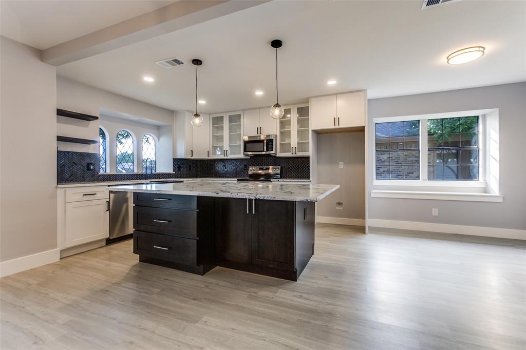 Fully Remodeled 5bd 3bath Modern Retreat with Dual Primary Suites in Prime Richardson Location!

This beautifully renovated 5 bedroom, 3 full bath home is the perfect blend of style, space, and function. From the moment you walk through the custom wrought iron front door, you're welcomed into an expansive open-concept layout filled with natural light and elegant finishes. The heart of the home is the designer kitchen featuring sleek white shaker cabinets, black herringbone backsplash, quartz countertops, a waterfall island, and premium stainless steel appliances — all overlooking a spacious living and dining area built for entertaining.

Boasting two luxurious primary bedrooms with spa-inspired en-suite bathrooms, this home offers flexibility for multi-generational living, guests, or a private retreat. Additional highlights include a modern wet bar, cozy fireplace with shiplap detail, stylish lighting, luxury plank flooring, and three fully updated bathrooms with high-end tile, dual vanities, and rainfall showers.

Located in a quiet, established neighborhood near top-rated schools, major highways, and local amenities, this property offers both comfort and convenience. Whether you’re looking for your forever home or a high-end investment opportunity, this one checks all the boxes.

Key Features:
5 spacious bedrooms, 3 full bathrooms
2 master suites with luxury finishes
Chef’s kitchen with oversized island
Wet bar and fireplace for entertaining
Fully remodeled top to bottom
Prime Richardson location

The home is done. The only thing missing is you.