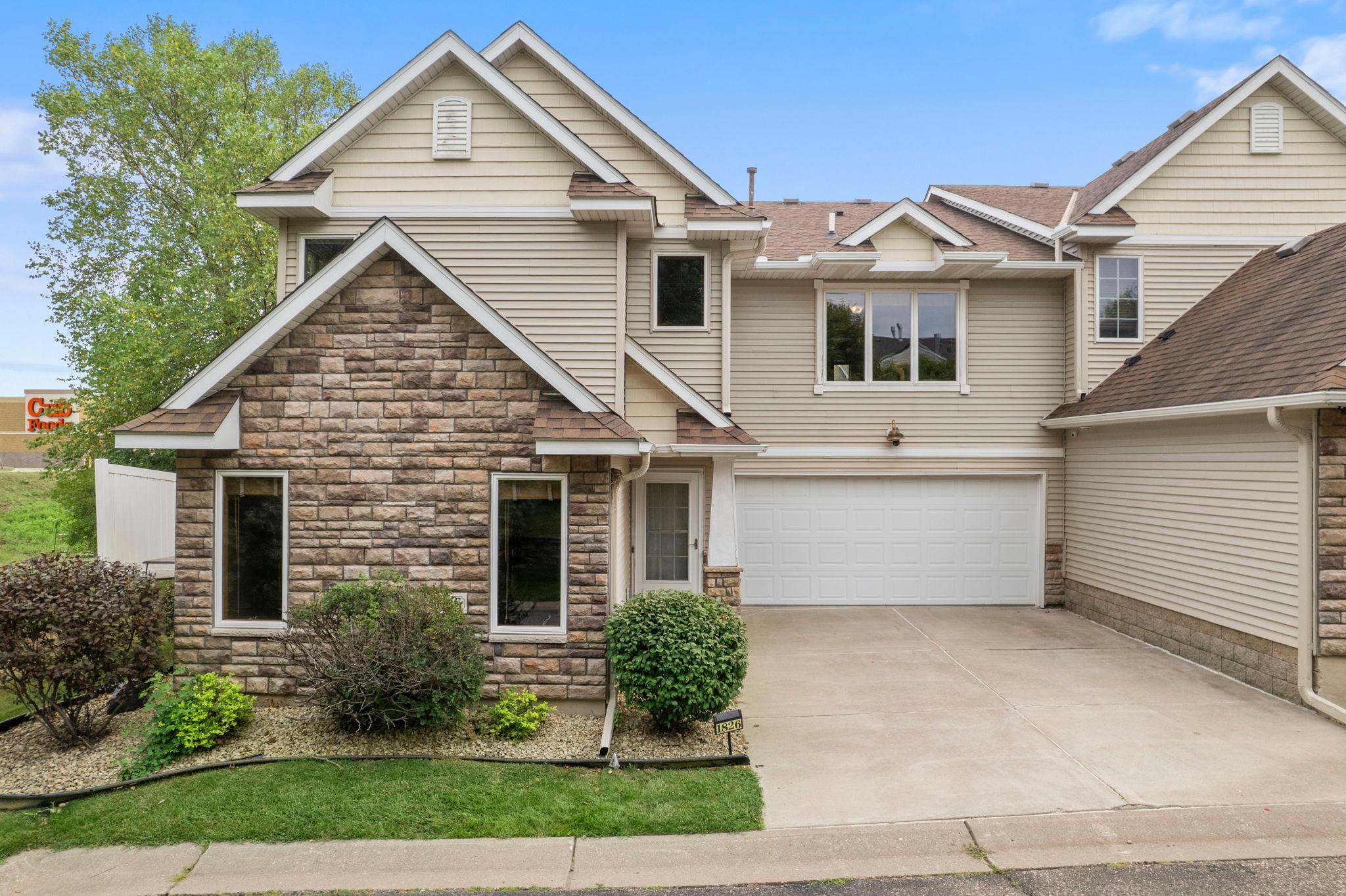 Welcome to this cozy three-bedroom, three-bathroom end-unit townhome in Hastings! Located near local dining, shopping, entertainment, parks, and the scenic Mississippi River, this home offers comfort, convenience, and easy access to the Twin Cities.Step inside to a bright main level with an open flow between the kitchen, dining, and living spaces. The kitchen features a peninsula with breakfast bar seating and a new refrigerator, microwave, and dishwasher installed in December 2022. The dining area includes a charming bay alcove and patio door leading to the side patio. The living room is centered around a gas fireplace with a stone surround, front-facing windows, and a built-in for storage, décor, or an entertainment setup. A powder bathroom, under-stair storage, and access to the attached two-car garage with shelving complete the main level.Upstairs, the primary suite features a walk-in closet and private three-quarter en-suite remodeled in 2026. Two additional bedrooms, including one with a built-in desk area, are served by a full bathroom remodeled in 2024. A flexible loft area and finished laundry room with a dryer replaced in 2023 complete this thoughtfully designed home.