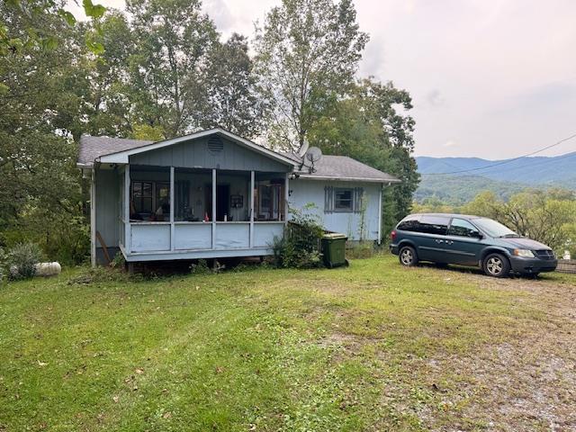 Great fixer upper! This 3 bedroom, 1 bath home at the end of Tatham Street has a nice yard and overlooks the mountains of the Andrews valley. The home is in the city limits and has town water, sewer and garbage service.  The home also offers an unfinished basement that is already framed in for another bedroom and bath and three other large rooms that can be used for an office, workshop or storage! The basement has an outside entrance so it could also be turned into Mother in Law quarters or an apartment to rent! The owners have recently repainted and upgraded the bathroom. With a little TLC this could be a great home! The home is being sold as is.