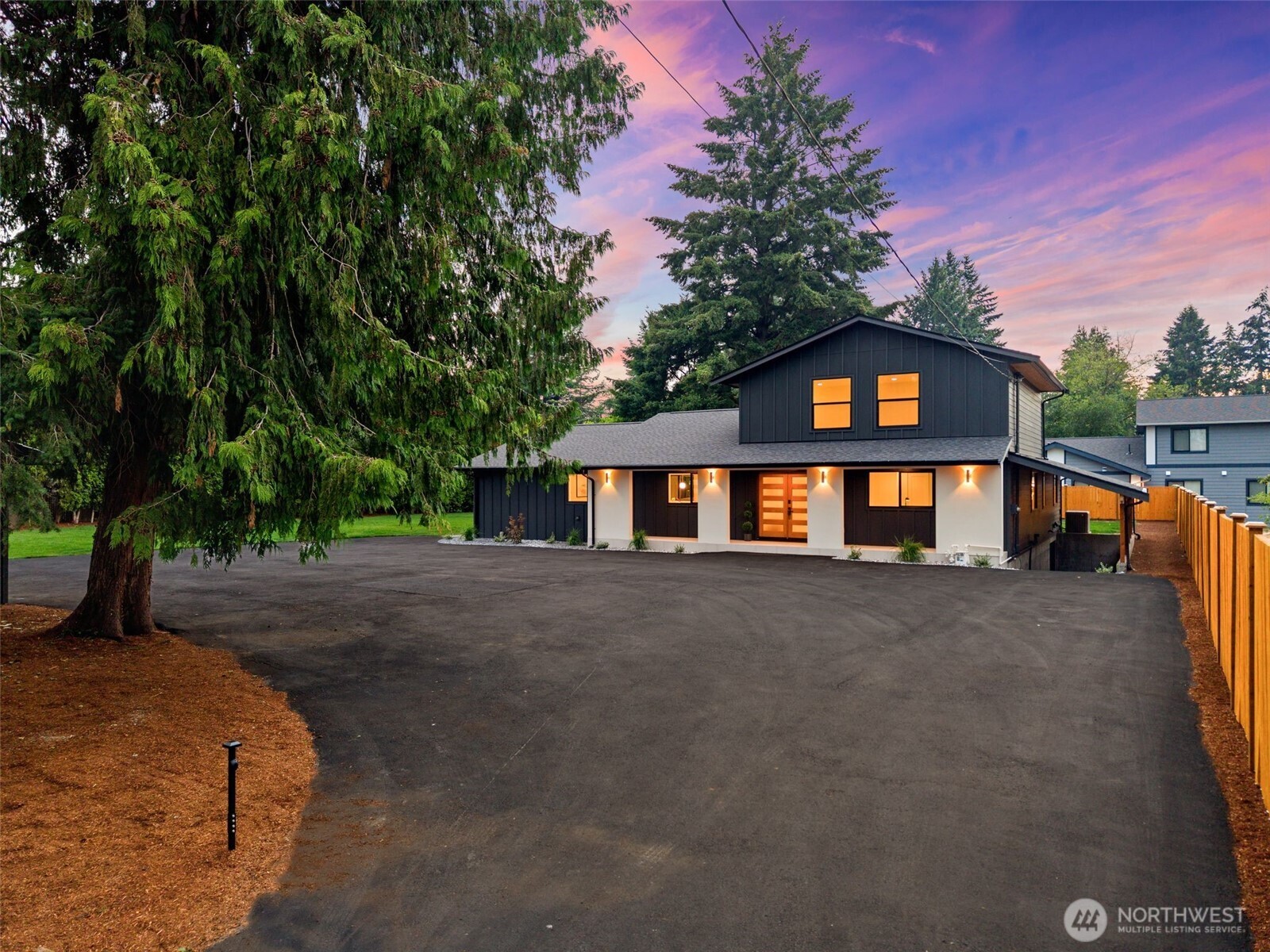 This exceptional luxury estate is fully permitted, extensively remodeled, and presents as brand new. Offering 3,040 sq ft with 5 bedrooms and 3 bathrooms,it showcases impeccable craftsmanship and elevated designer finishes throughout. Set on over half an acre, this private gated property delivers a rare blend of sophistication,functionality,and future upside,including a DADU and potential sub-plat opportunity. A grand gated entry opens to pristine,fully fenced grounds with expansive parking and an impressive 800 sq ft detached 2-car garage. An additional 2,400 sq ft lower level offers incredible versatility—ideal for a luxury home gym, executive office,media room, or private retreat. The main level features a bright open-concept design with an expansive living room,oversized waterfall island,custom chef’s kitchen,and refined bar area. Highlights include full-height quartz backsplash,premium stainless appliances, under-cabinet lighting, a spacious walk-in pantry,and a striking plaster-finished hood. A statement fireplace anchors the space, while access to the Trex deck creates seamless indoor-outdoor living.Four bedrooms on the main level, along with a beautifully appointed guest bath and oversized laundry room. The primary suite is a private retreat featuring a custom walk-in closet, elegant electric fireplace,and spa-inspired bath with freestanding soaking tub, heated floors, curbless shower, and designer tile work. Expansive grounds and firepit complete this rare offering.
