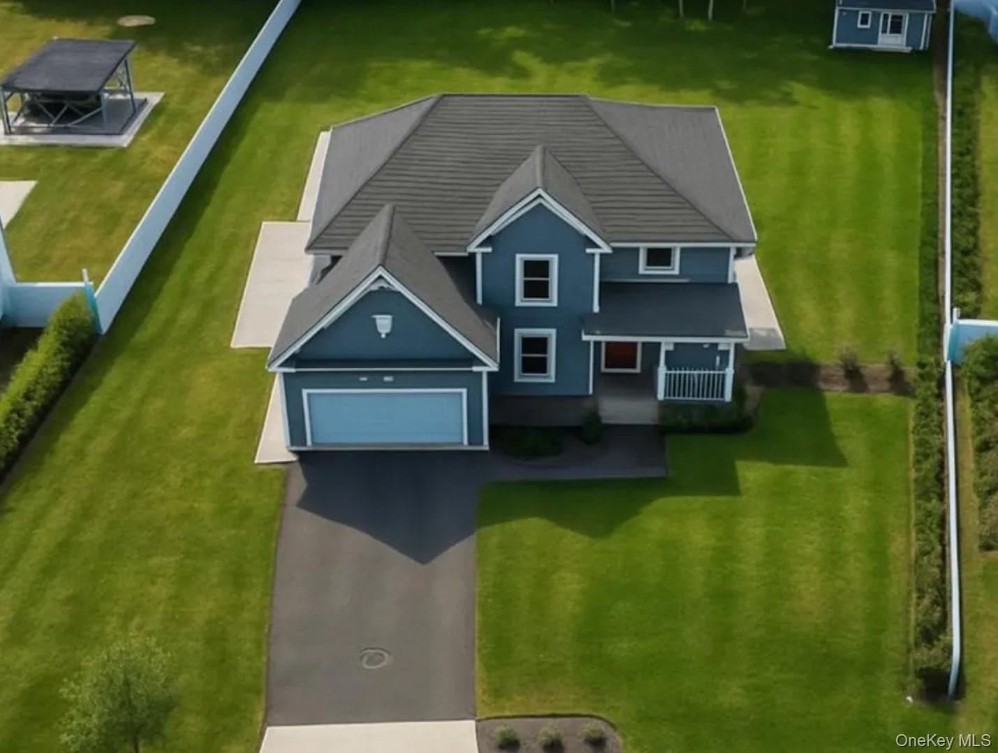 Welcome to 9 Shaw Lane, a brand-new 2023 custom-built home on a private cul-de-sac in East Moriches. This 4-bedroom, 2.5-bath residence offers over 3,200 sq ft of living space on nearly half an acre. The open floor plan features a chef’s kitchen with quartz countertops, custom cabinetry, and premium appliances, flowing into the dining and living areas with a cozy fireplace and oversized Andersen windows. Upstairs, the spacious primary suite is complemented by three bedrooms and a full bath. A walk-out basement offers room to expand for a gym, media room, or guest space. Modern features include instant hot water, energy-efficient systems, and today’s most desirable finishes. Outdoors, enjoy a landscaped yard with patio, fire pit, and privacy hedges. Minutes from beaches, marinas, and the Hamptons, this home combines luxury, comfort, and coastal living.