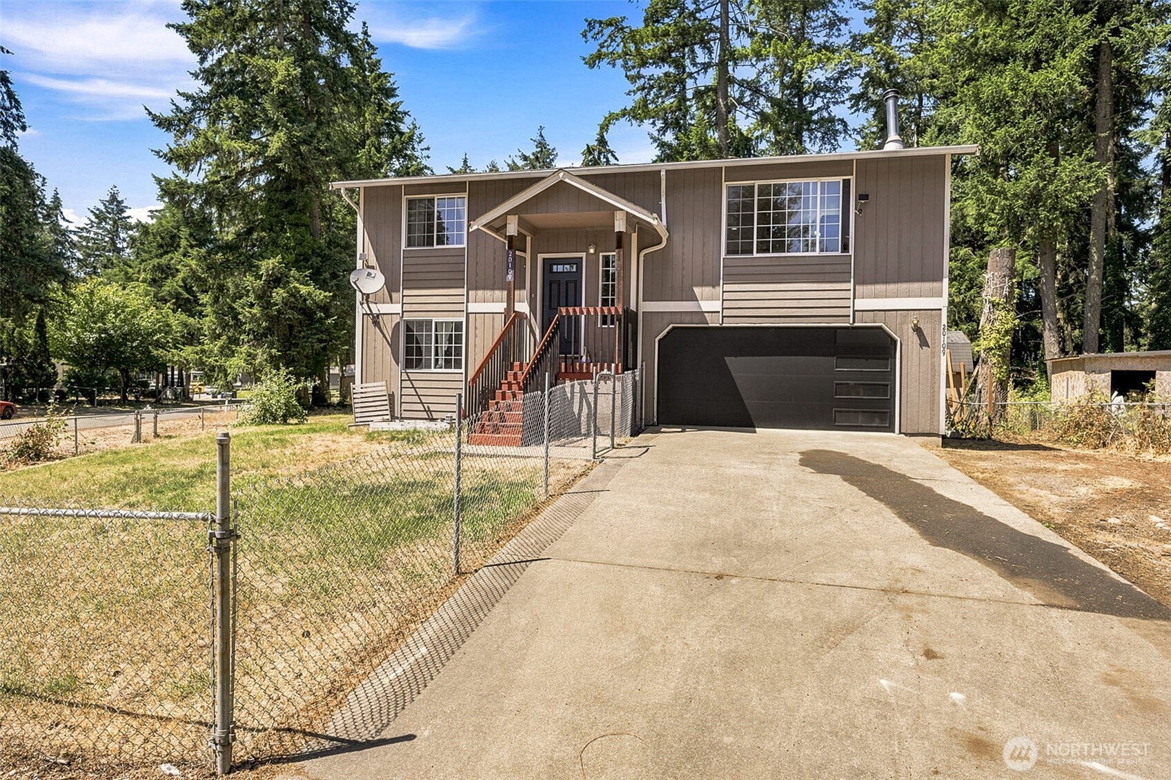 Welcome home to this beautifully maintained split-entry home tucked away on a quiet cul-de-sac in Spanaway! Offering 3 bedrooms, 2 full baths, and 1,339 square feet of comfortable living space, this home features durable vinyl plank flooring, a spacious living area, and a dining room perfect for gathering with family and friends. The primary suite includes a private bath and walk-in closet for added comfort. Step outside to enjoy the fully fenced backyard complete with a deck, patio, garden space, and storage outbuilding—ideal for entertaining, relaxing, or creating your dream outdoor retreat. Situated on a generous corner lot with gated entry, RV parking, electric vehicle charging, and wiring for a generator, this property offers both convenience and peace of mind. Located close to schools, shopping, dining, parks, and JBLM, this home combines everyday functionality with a fantastic location. Don't miss your opportunity to make it yours!