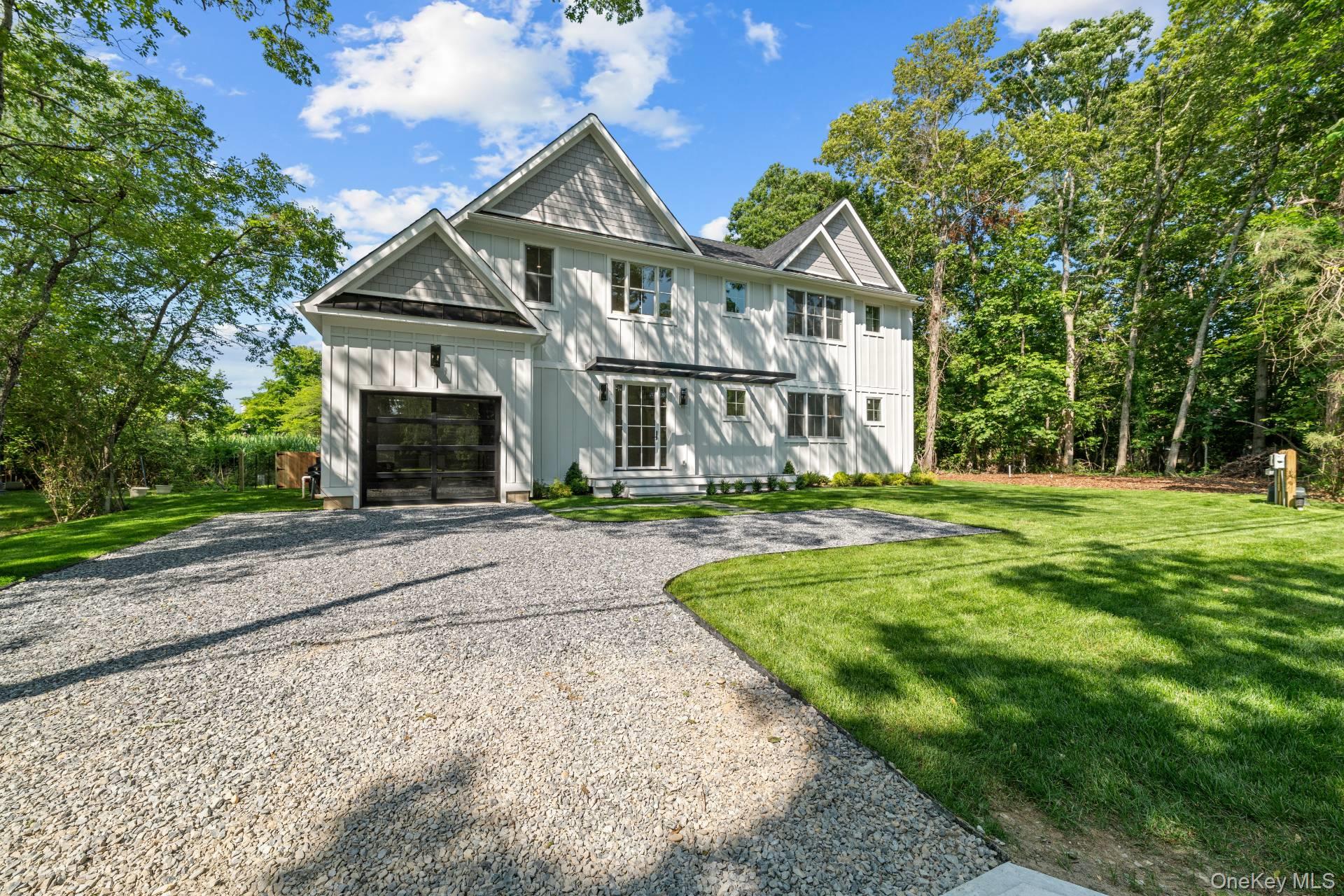 NEW CONSTRUCTION, MOVE IN READY
Experience the pinnacle of sophisticated coastal living in this exceptional, newly completed home, now available for the first time. Situated on a desirable private street with easy access to both Southampton Village and Sag Harbor Village, this residence is just 800-feet from a tranquil Peconic Bay beach and boasts glorious winter water views and stunning sunsets from the upper floor deck. This home masterfully blends indoor and outdoor spaces, which are perfect for entertaining, with glass sliding doors spanning the entire rear of the house, allowing you to seamlessly transition from the chic interior to the outdoor oasis. Upon entering, your gaze will be drawn through the open living space to the heated Gunite pool and back deck. The main level features a convenient junior primary en-suite bedroom and bath, alongside a spacious living/dining room featuring a cozy fireplace and sliders accessing the pool area. The kitchen is a dream, outfitted with quartz countertops, an expansive island with waterfall edges, a generous large (walk in) pantry, and high-end Viking appliances. The second story boasts four additional en-suite bedrooms, including a private primary bedroom and bath appointed with high end Carrera marble tile and a balcony providing serene views of the lush backyard. As a bonus, the top floor provides a second option for indoor/outdoor living . This is more than a home; it's a lifestyle waiting to be enjoyed.
