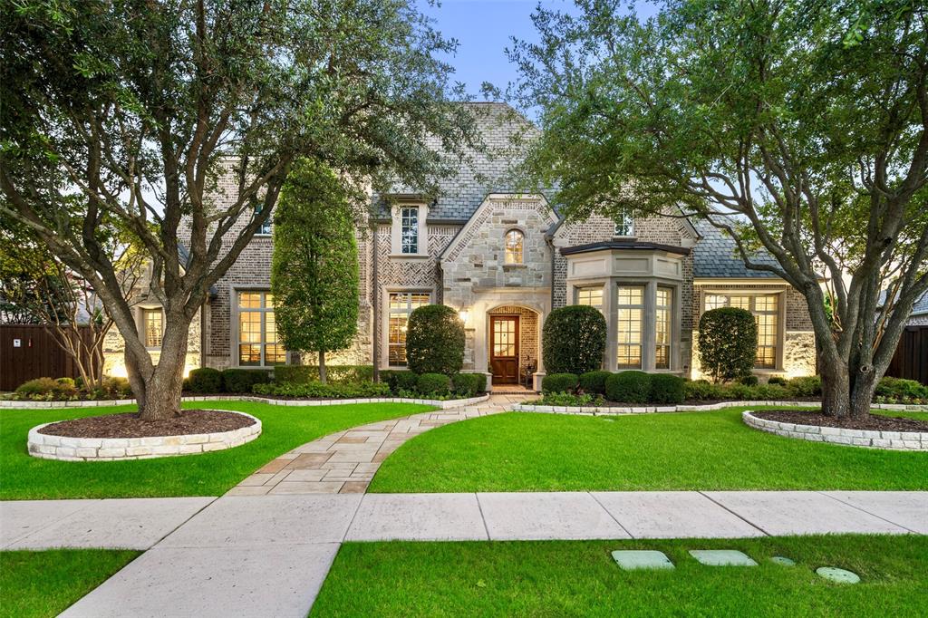Stunning Sanders Custom Home in Lexington at Twin Creeks—one of only three custom phases in this master-planned community. On an almost one third acre lot and ideally located on quiet street across from park, this home offers luxurious living inside & out. Enjoy your own private backyard oasis featuring a modern pool & spa with three fountains, lush landscaping and a large outdoor living area with fireplace, built-in grill, speakers—perfect for entertaining. Inside, you’ll find high-end finishes throughout: handscraped hardwoods, plantation shutters, 8-ft solid wood doors downstairs, three fireplaces, custom built-ins, & updated designer lighting. All bedrooms have en suite baths. The spacious family room is the focal point of the home &  includes beamed ceiling, stone fireplace and is open to the gourmet kitchen with a huge island, custom ceiling-height cabinetry, double ovens, Wolf 6-burner cooktop, Bosch dishwasher, built-in refrigerator & walk-in pantry. Breakfast nook features custom built in for add’l storage or serving. The formal living & dining rooms sit off the entry, along with a private study featuring rich wood paneling, built-ins, coffered ceiling & fireplace. The primary suite offers views of the pool, vaulted beamed ceiling, a spa-like bath with jetted tub, oversized shower, dual vanities, marble counters & large walk-in closet with built-ins & off-season rods. Guest suite down. Flexible exercise or dance room with pool view, additional bonus room & powder room downstairs. Large laundry room with built-ins, desk, sink & two mud areas. Upstairs includes a huge game room with wet bar (sink, microwave, fridge), built-in desk, powder room & media room ready for movie night with screen, projector, speakers & receiver included. 3-car garage with Gladiator shelving, storage & workbench; electric gate, enclosed dog run, more. Class 4 impact-resistant designer shingles replaced in 2023 can lower insurance premiums.Short distance from Mary Evans Elementary.