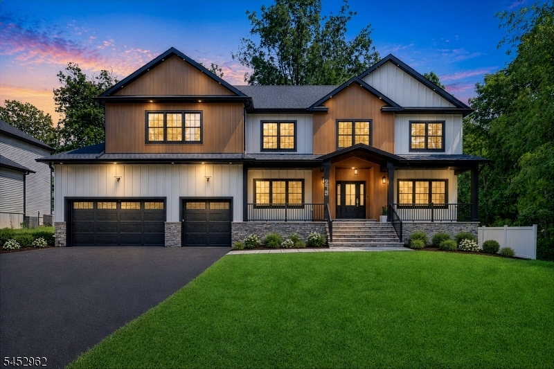 Welcome to this remarkable luxury new construction home, where sophisticated design, impressive scale, and meticulous craftsmanship come together on nearly half an acre. An expansive stone front porch welcomes you into a soaring two-story foyer. At the heart of the first floor is a designer Fabuwood kitchen featuring a large waterfall island, abundant cabinetry, a walk in pantry and a seamless flow into the two-story family room, where architectural detailing and a remote-controlled gas fireplace set the scene for relaxing or entertaining. A formal dining room, living room, mudroom, powder room, and desirable first-floor bedroom with ensuite complete this level. Upstairs, a versatile sitting area offers space for an office, reading lounge, or retreat. Each of the home's five bedrooms enjoys direct access to a full bath, custom closets, and distinctive accent walls. Bathrooms feature floor-to-ceiling tile, LED mirrors, and smart toilets. 9-ft ceilings, white oak floors, Andersen 400 Series windows, custom millwork, second-floor laundry, a Trex oversized deck, fenced backyard, a 3-car garage with a EV charging point and a 30 ft wide driveway further elevate the home. Convenient to I-80, I-287, Routes 46 & 10 and NYC transportation. Welcome home!
