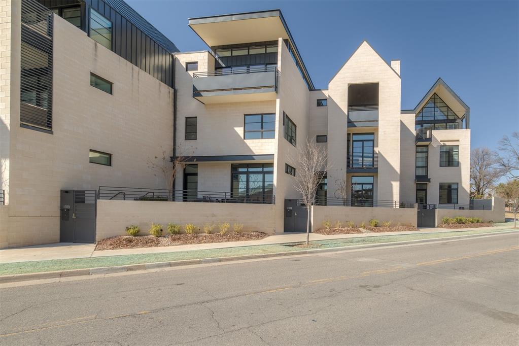 Located within Villa Teresa, this residence offers a thoughtful layout designed for both daily living and professional flexibility.The attached garage provides direct access into the home, where a powder bath is conveniently positioned nearby. The primary suite includes a dedicated office space—ideal for remote work, creative pursuits, or additional lounge flexibility.On the second level, a fireplace anchors the living space, adding warmth and architectural interest. Washer and dryer connections are located on the first floor for streamlined functionality.Villa Teresa Residences are in a prime position in the heart of Midtown Oklahoma City. Surrounded by historic architecture and established streetscapes, the community offers direct connectivity to the Downtown core, Arts District, Uptown, and the streetcar line. Midtown’s dining, entertainment, fitness, and retail destinations are all in close proximity, creating an urban lifestyle defined by accessibility, energy, and character. Villa Teresa blends contemporary residences with the charm and vibrancy of one of Oklahoma City’s most sought-after districts.