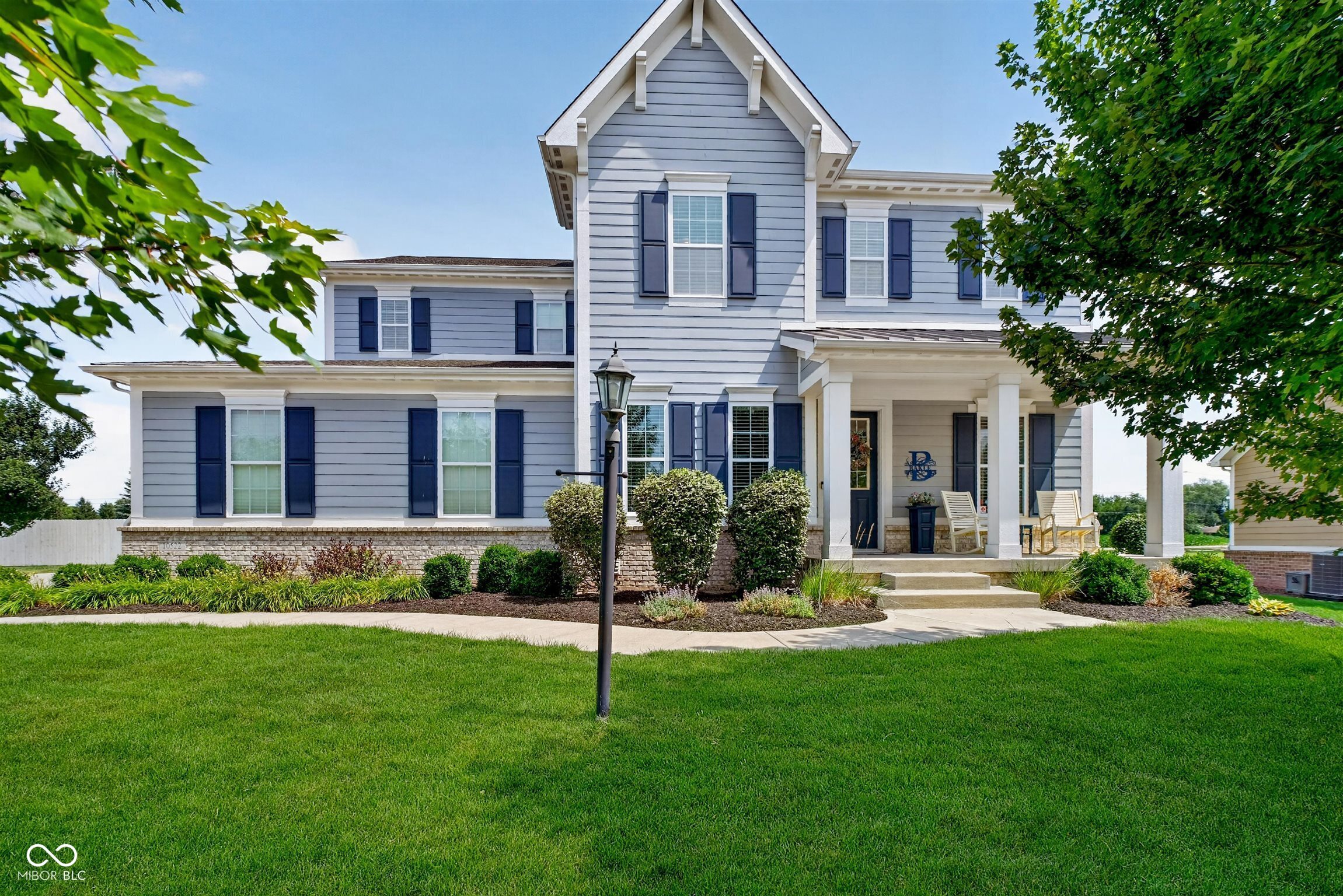 Nestled on a beautifully wooded cul-de-sac lot in Fishers' sought-after Anderson Hall subdivision, this stunning 5 bedroom, 3.5 bath home built by Estridge offers over 3,200 square feet of thoughtfully designed living space, all within the acclaimed Hamilton Southeastern Schools district and Fishers High School boundary.    The main level welcomes you with rich hardwood floors flowing through the dining room and kitchen. The eat-in kitchen is a chef's dream, featuring a center island, breakfast bar, built-in oven, electric cooktop, and a walk-in pantry, all open to a warm family room with a gas log fireplace. A formal dining room and combo dining/kitchen area offer flexibility for both everyday meals and special gatherings.    Upstairs, the primary suite is a private retreat with a sitting room, walk-in closet, and a spa-inspired bath boasting double sinks, a garden tub, and a separate shower stall. Four additional bedrooms provide plenty of space for family or guests, and an upstairs laundry room adds everyday convenience.    The partially finished basement, with 9-foot-plus ceilings, egress windows, and roughed-in plumbing, offers exciting potential for additional living space, a home gym, or media room, plus ample storage.    Outside, enjoy a covered patio overlooking the mature trees of this private lot, with gutter guards and accent lighting adding to the home's low-maintenance appeal. A three-car attached garage provides abundant parking and storage. Anderson Hall residents enjoy access to a clubhouse, community park and playground, walking trails, and pool. Homes like this in Anderson Hall don't last long - schedule your private showing today!
